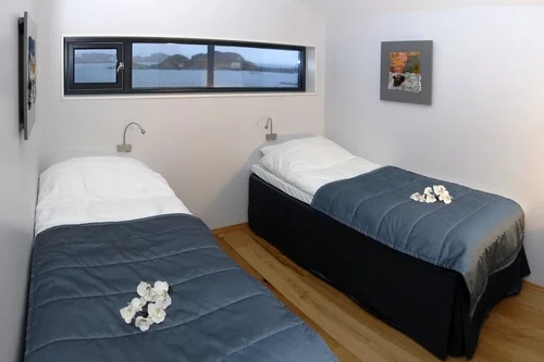 You will have your own private twin bedroom with ensuite facilities, with views overlooking the bay.