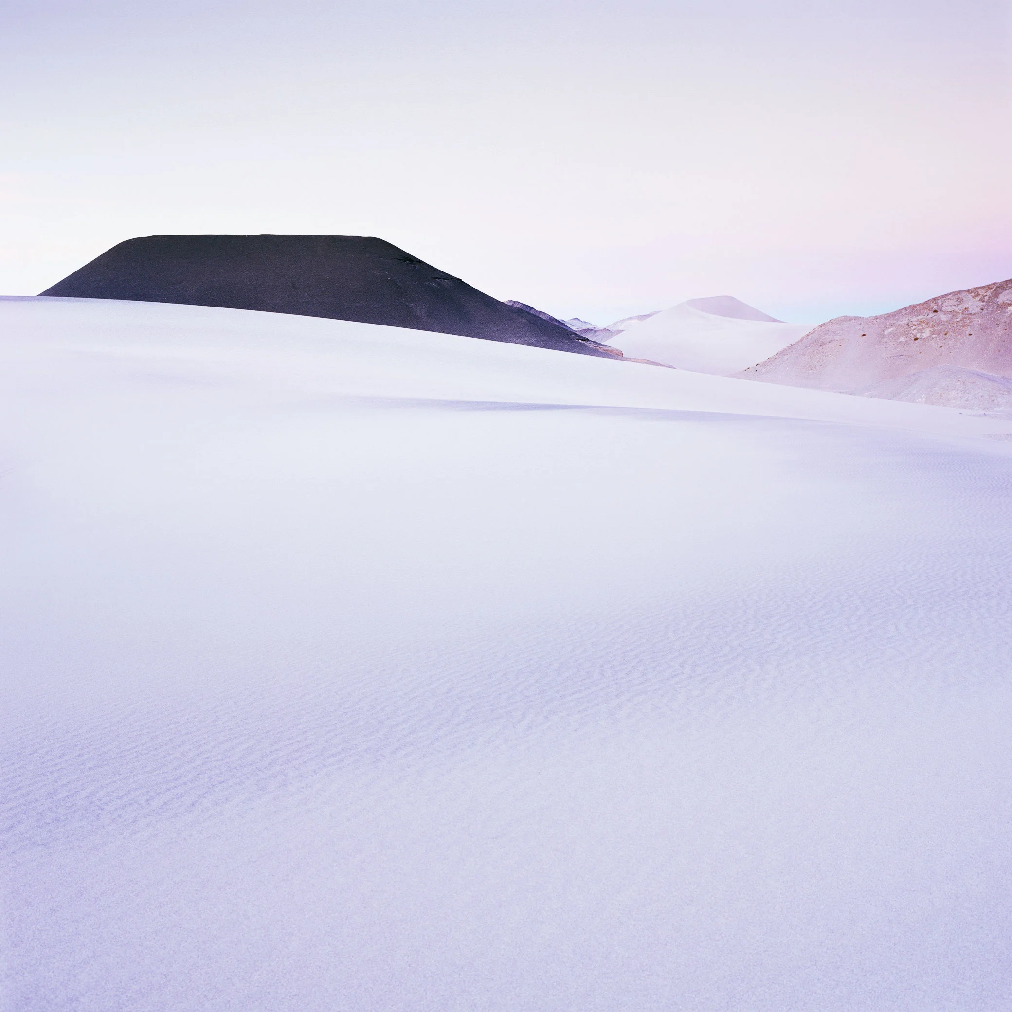 Image was left 'soft' and I applied careful local contrasts to the Volcano only. This gives the 'impression' that there is contrast in the image, while maintaining softer tones in the frame. Thus resulting in a more 'calm' and less fatiguing image to look at.