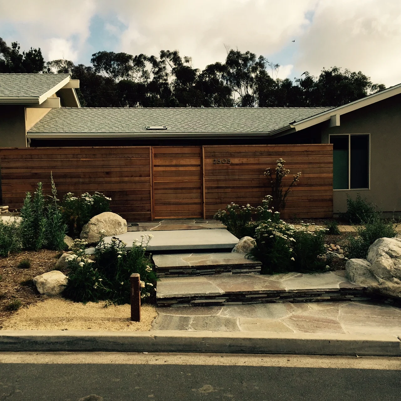 Custom light fixtures, concrete bridge and enormous boulders