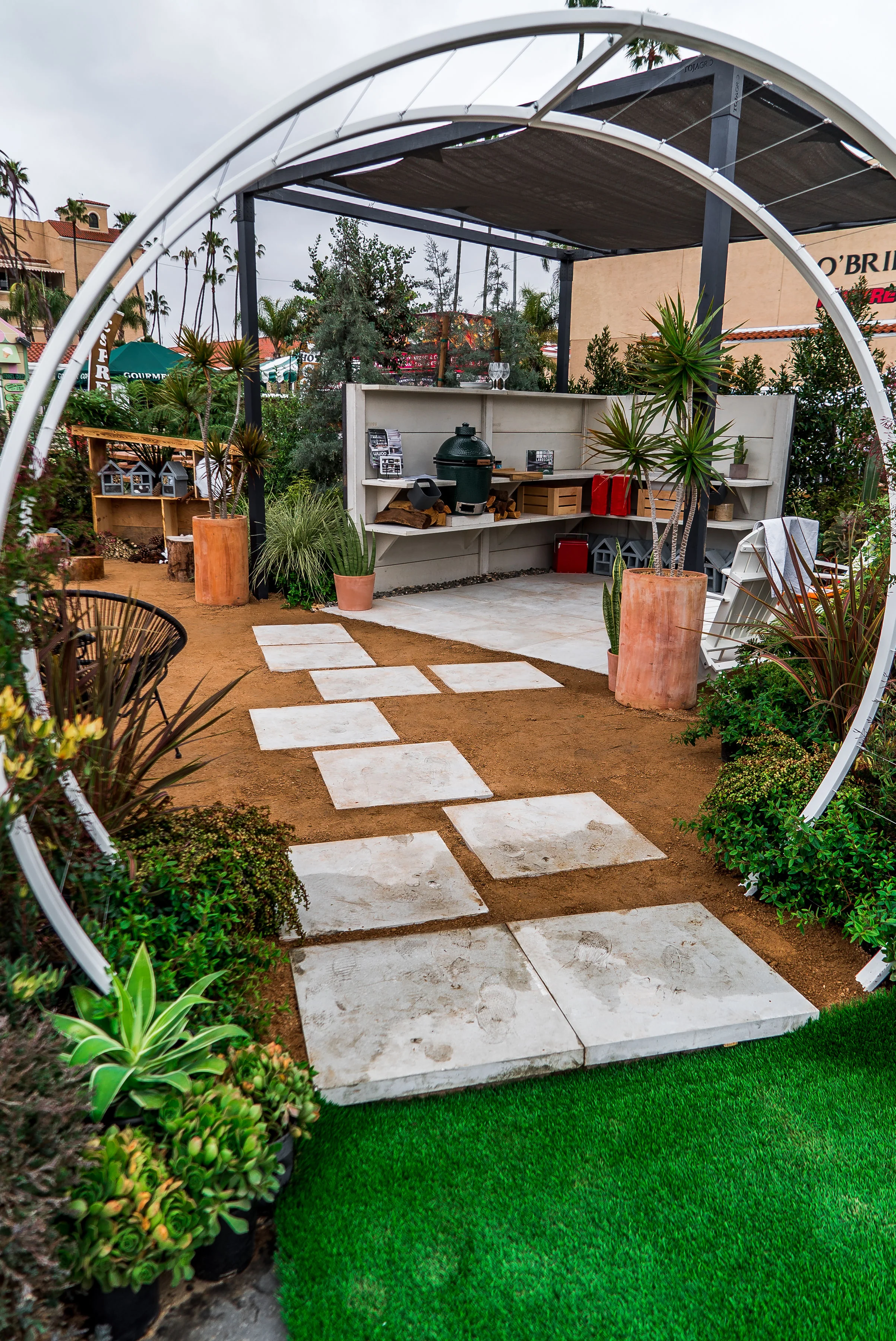 WWOO kitchen made from pre-fabricated concrete, made to be customizable and easy assembly Toja Grid as an overhead structure.