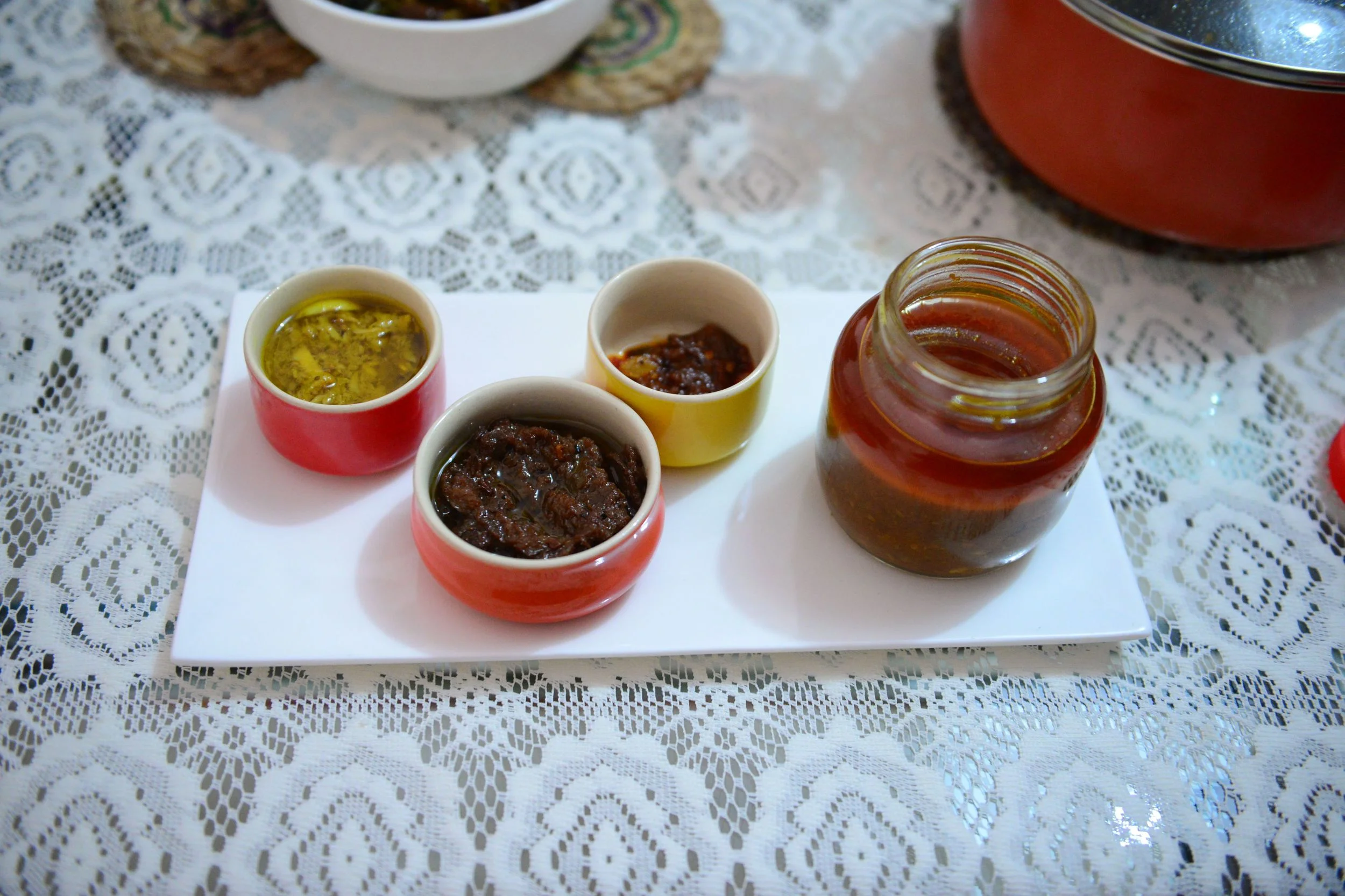 From L to R- Bamboo shoot chutney, Indian olives paste, Killer Naga chili, and the Pork Pickle