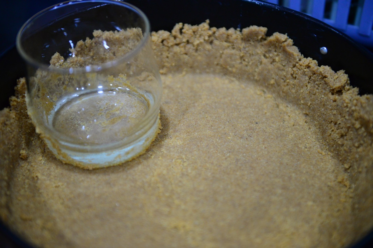 Use a flat bottom glass to spread the mixture, it will rise to the sides automatically