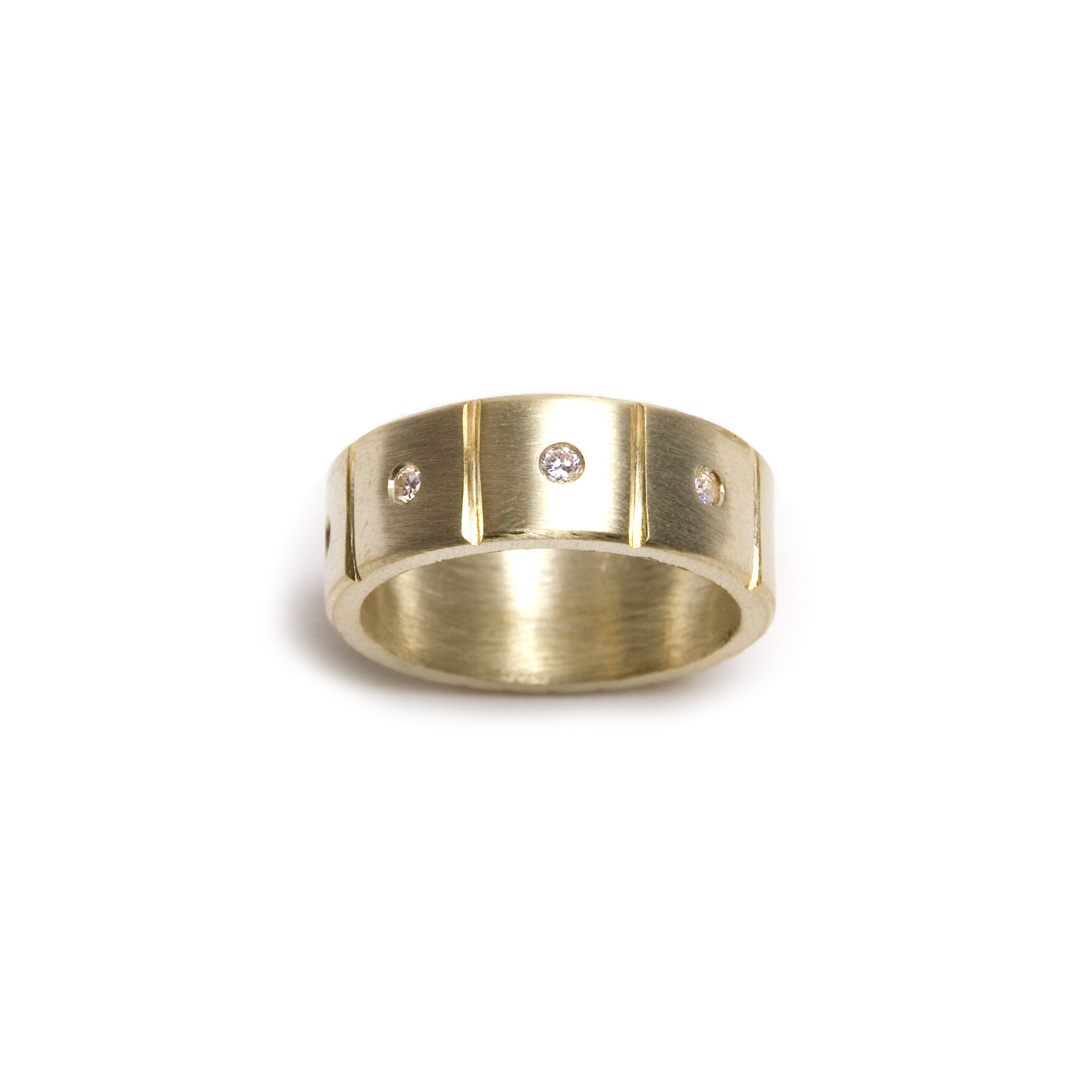 square patterened wide diamond band in fourteen karat gold