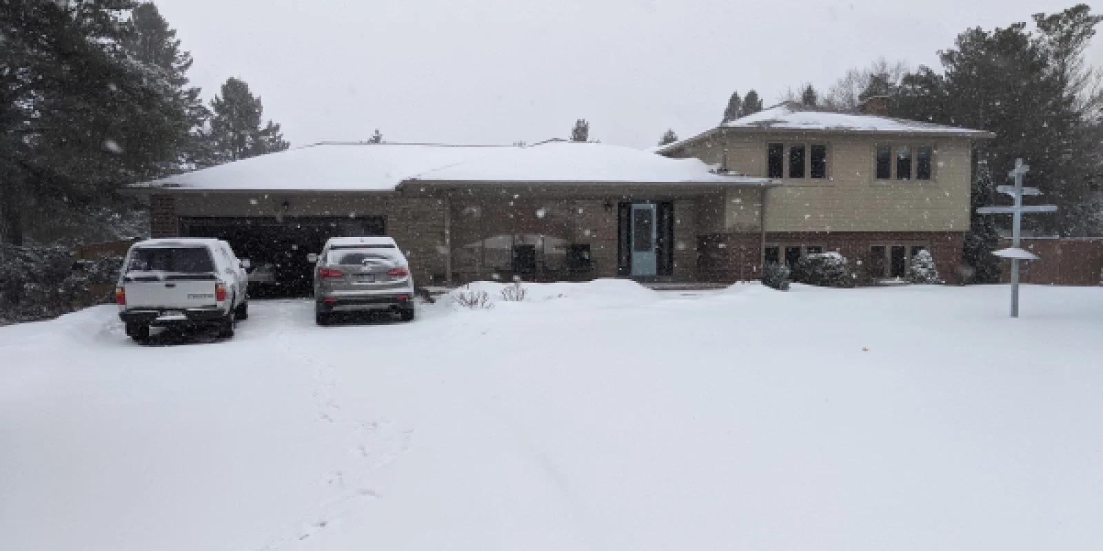 Photo of an existing side split home prior to three storey addition building permit project.