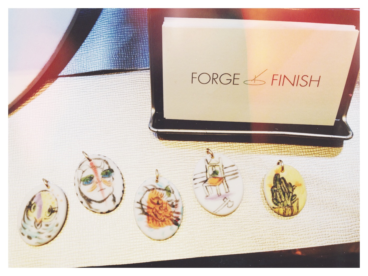 Killer hand-painted ceramic pendants are 100% one-of-a-kind. They are available in South Philly boutique Nice Things Handmade