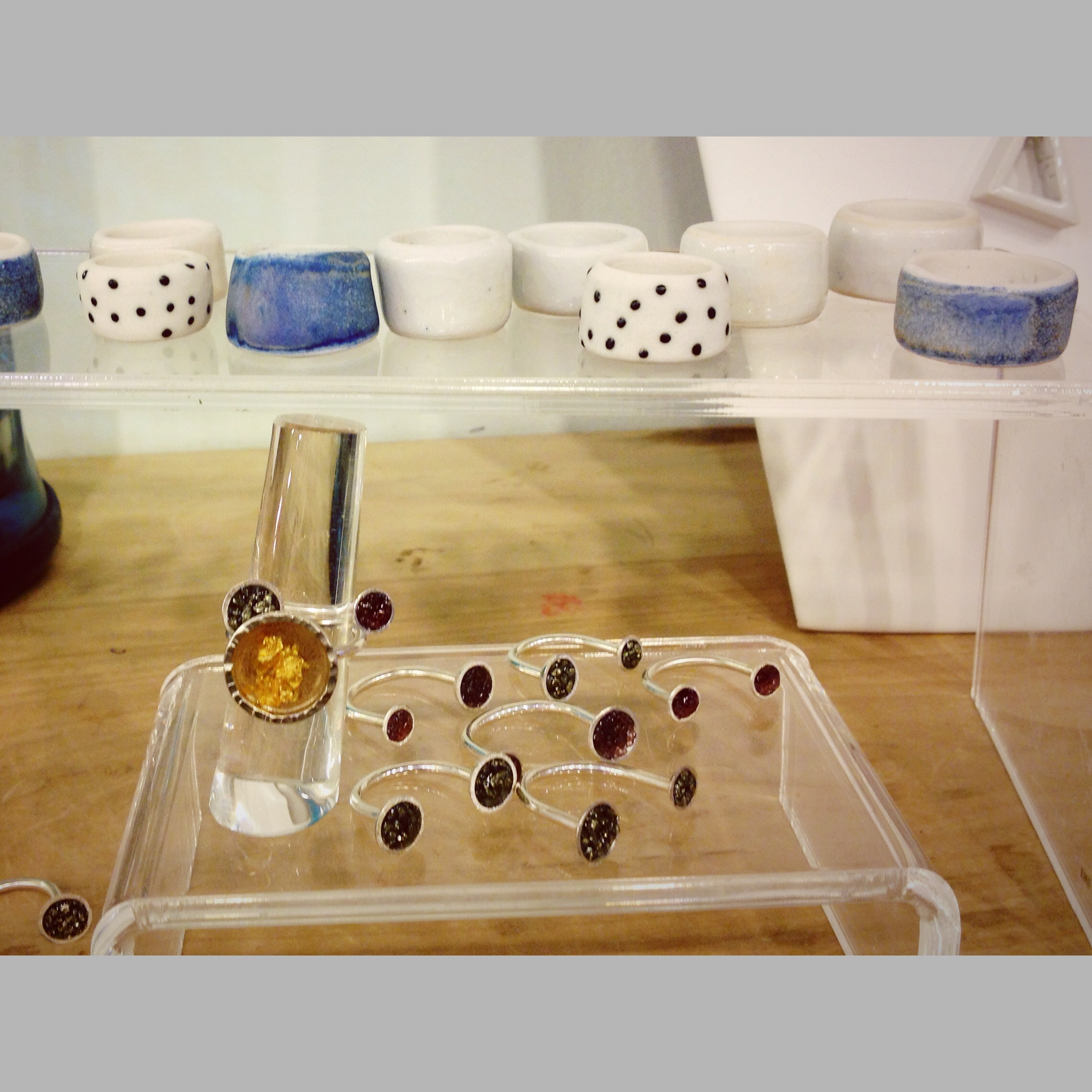 Forge & Finish is proud to have Happy Land Handmade ceramic and knit wares compliment our web store. Seen here: assorted Happy Land Handmade ceramic rings, our classic Galaxia Ring and fresh pyrite & garnet Satellite Rings.