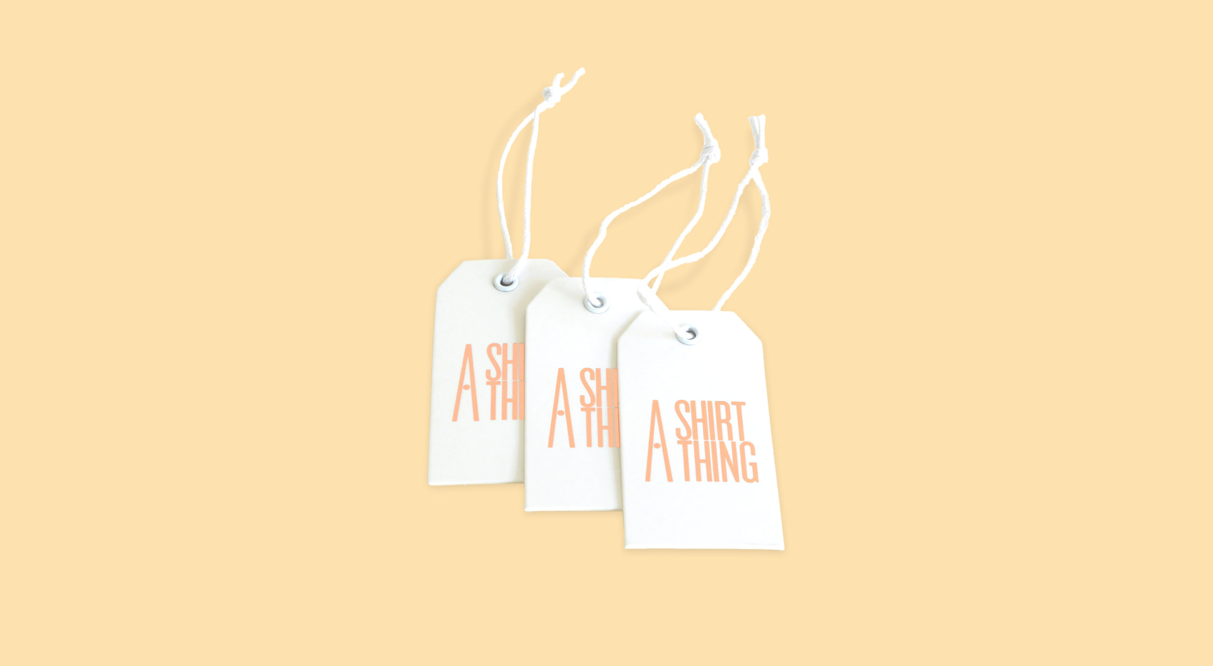 A Shirt Thing hang tags with copper hot foil stamp