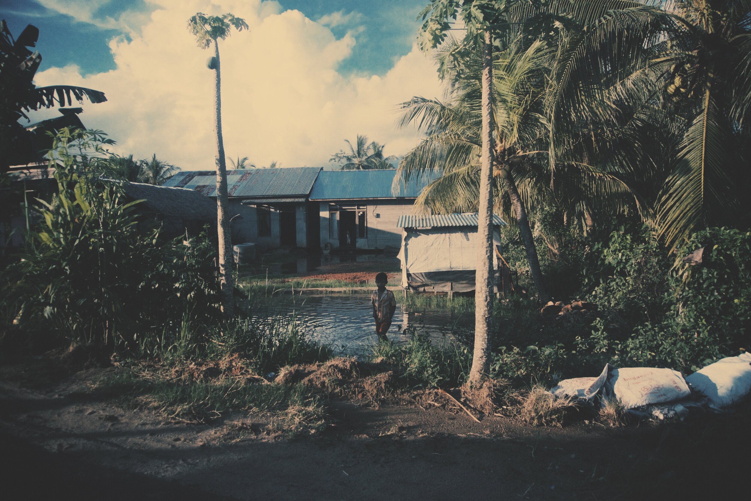 Indonesian Boy in Small Pond.JPG