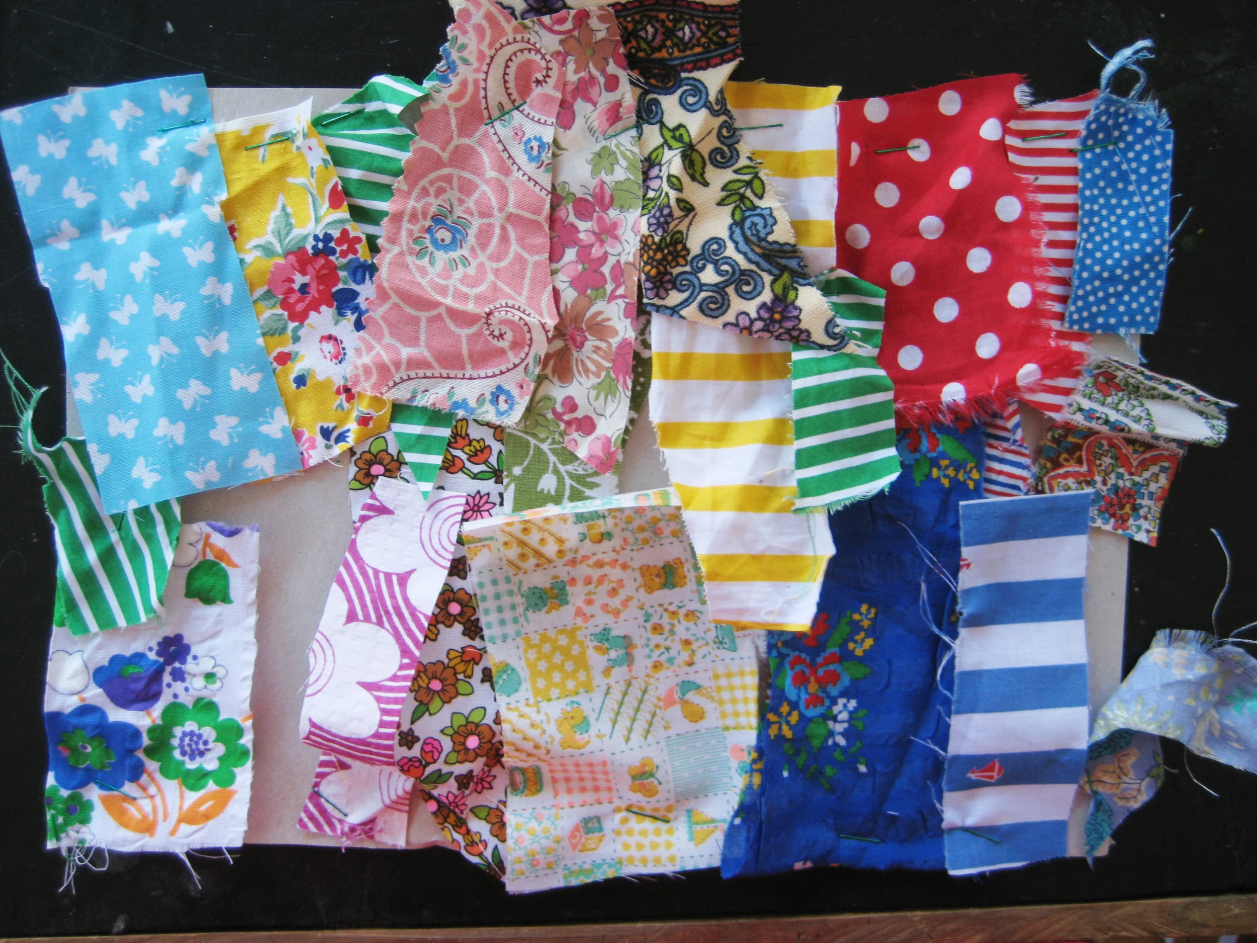Summery cotton fabric samples for next year, already pinned to my workroom wall.