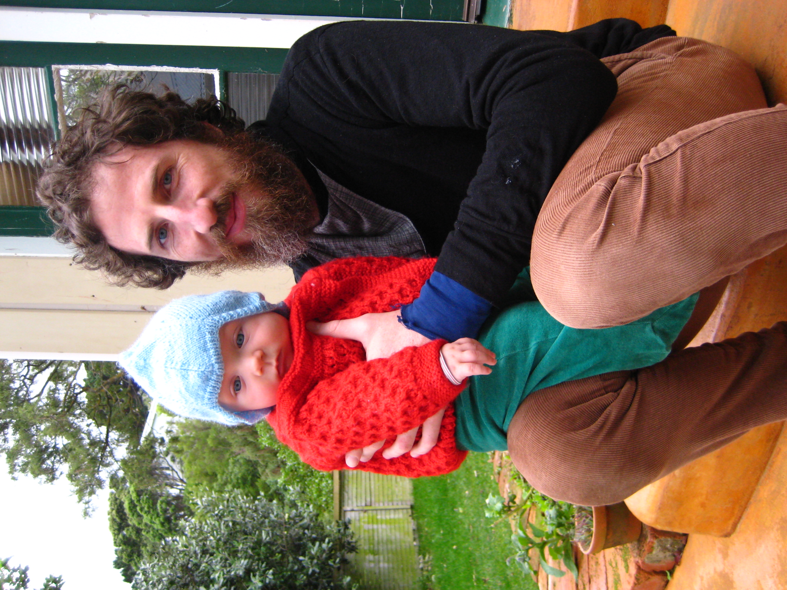 Op-shop-tastic: Home knits and green velor pants = part baby, part elf.