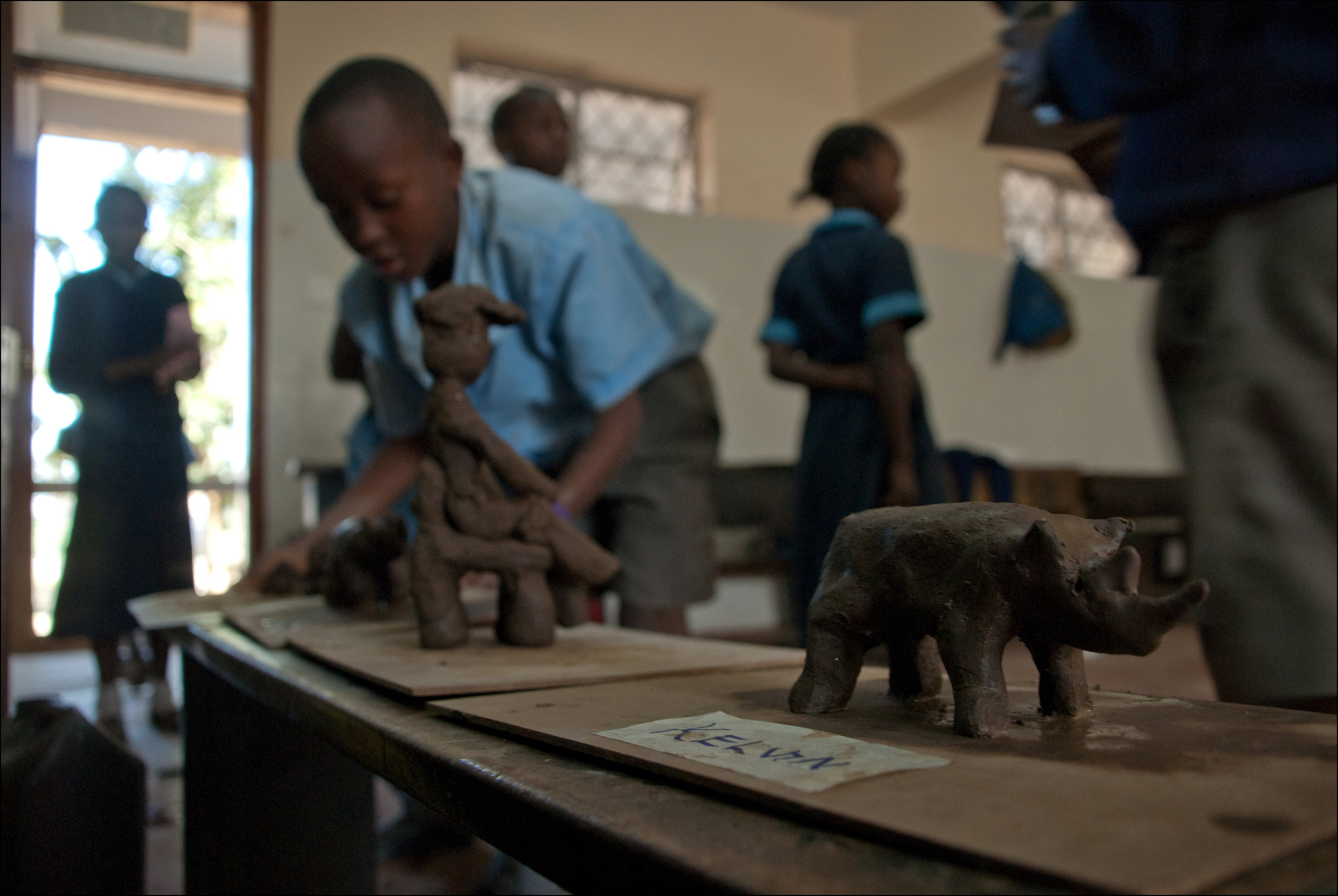 children work with clay for the first time