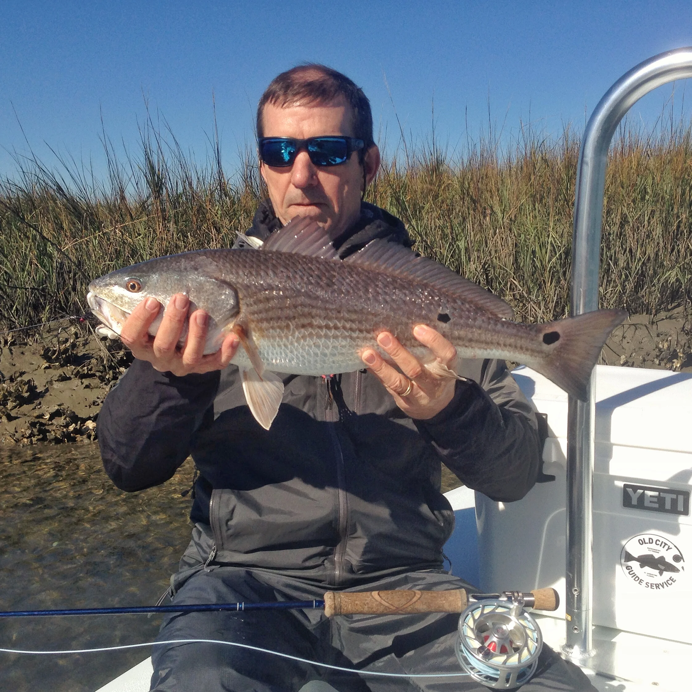 Fly fisher with a wintertime redfish
