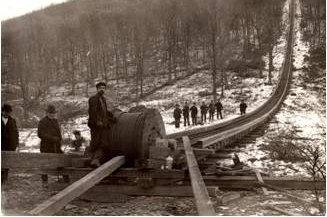 A work crew installs the railway's 1-3/8 inch lang-lay pattern steel cable, which weighed 7,000 lbs. The cable manufacturer was likely John A. Roebling's Sons, Inc. of Trenton, NJ Courtesy Beacon Historical Society