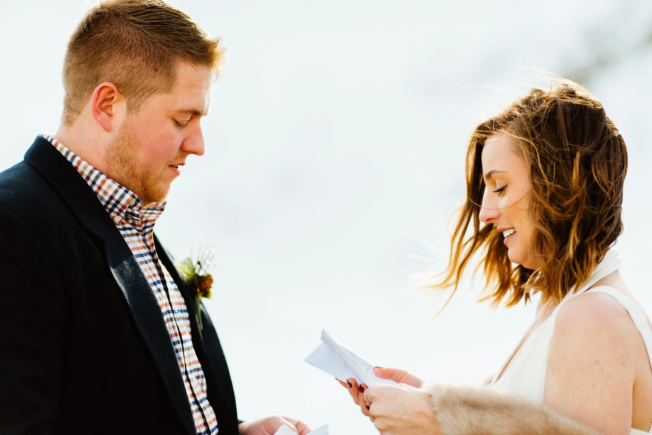 What a precious moment captured of Kelsie and Tyler saying their vows at their Rocky Mountain wedding ceremony. St. Mary's Glacier sure is an amazing spot to tie the knot! | Intimate mountain elopement photos by outdoor wedding photographer, Maddie Mae.