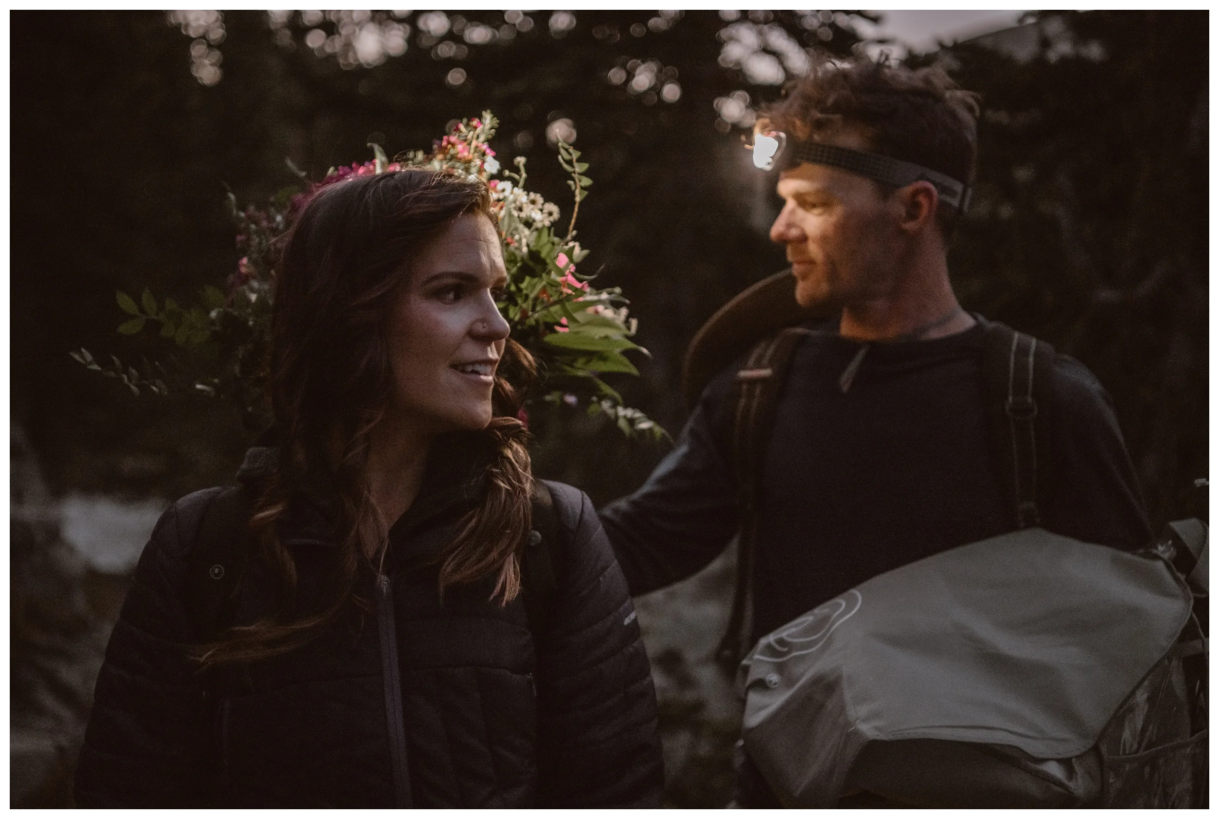 Karen carries her bouquet on her back for her adventure elopement with Matt as they hike up to Lake Isabelle before dawn. Photo by Adventure Instead, Maddie Mae.
