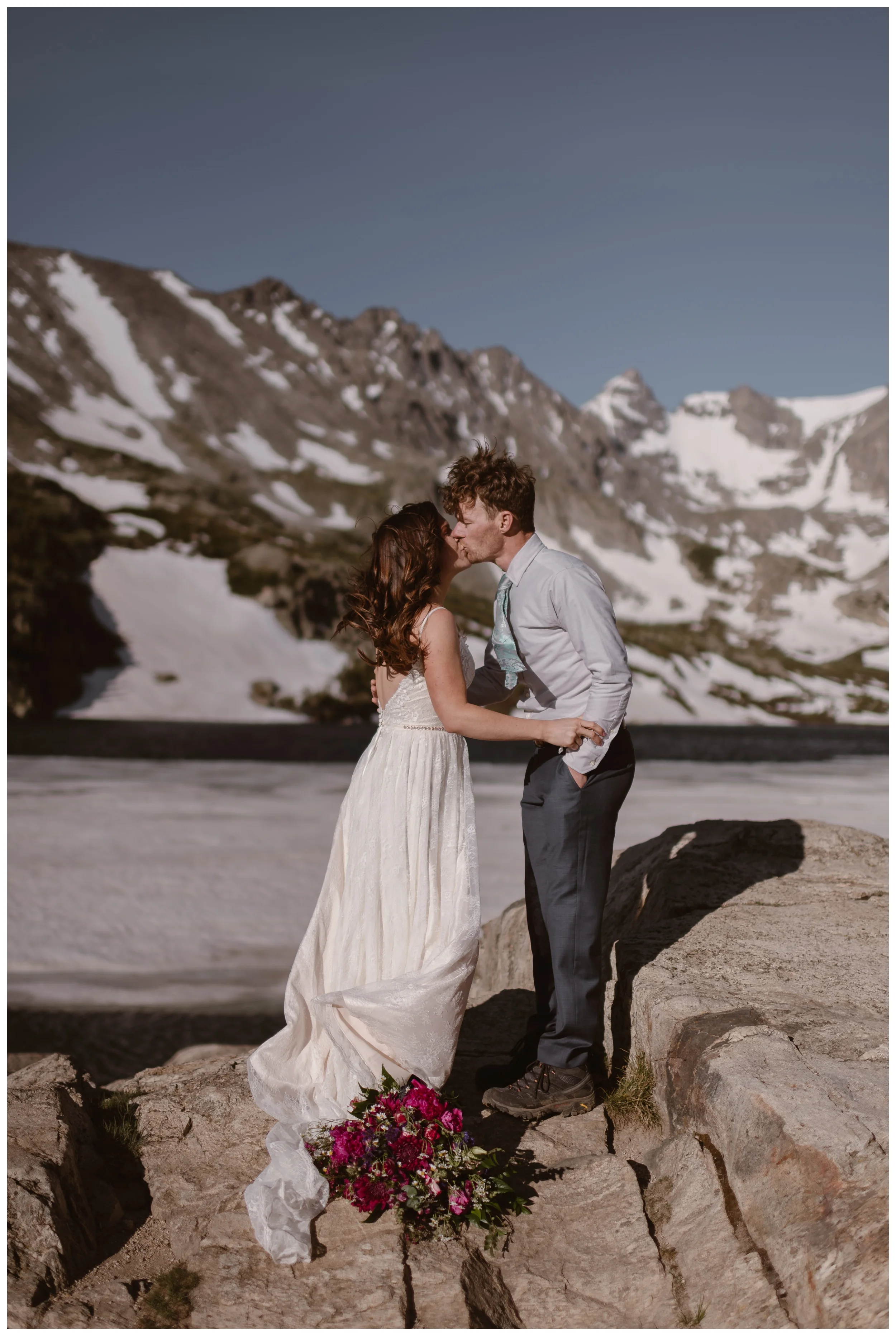 Karen and Matt seal their high alpine lake elopement with a kiss after they hiked to the top of Lake Isabelle outside Boulder, Colorado. Photo by Adventure Instead, Maddie Mae.
