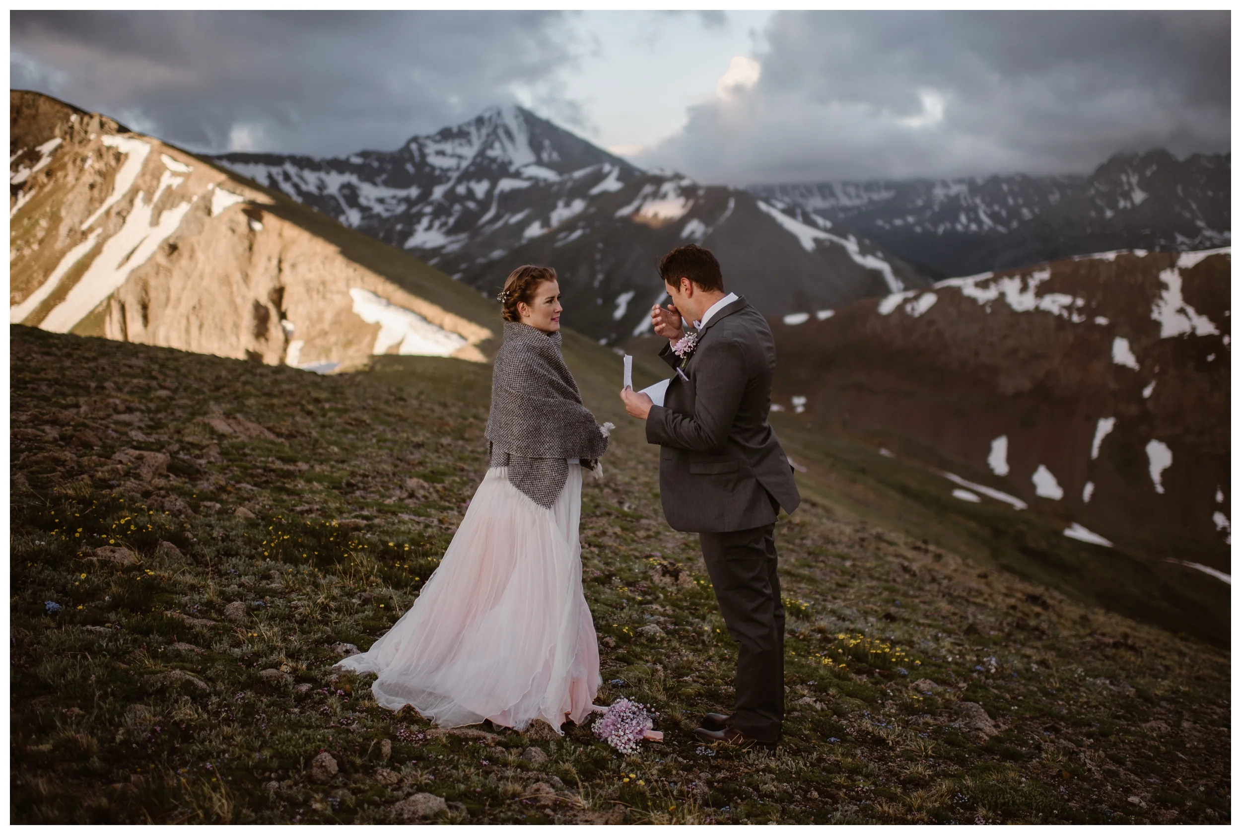 Vasily wipes away a tear reading his vows to his bride as the sun begins to rise around them above Independence Pass outside Aspen, Colorado. Photo by Maddie Mae, Adventure Instead.