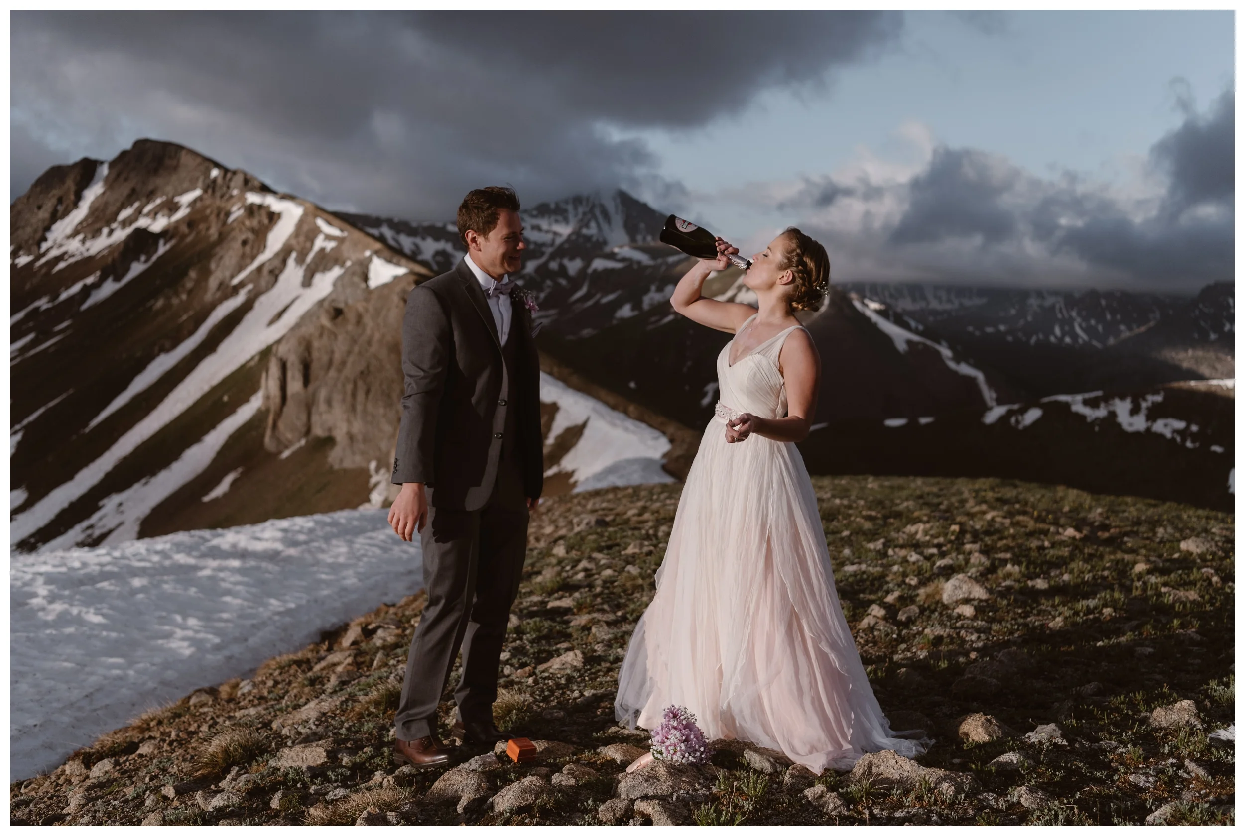 To celebrate their elopement ceremony, Marcela and Vasily opened a bottle of champagne and drank it while surrounded by the jagged peaks of the Sawatch Range of the Rocky Mountains. Photo by Maddie Mae, Adventure Instead.