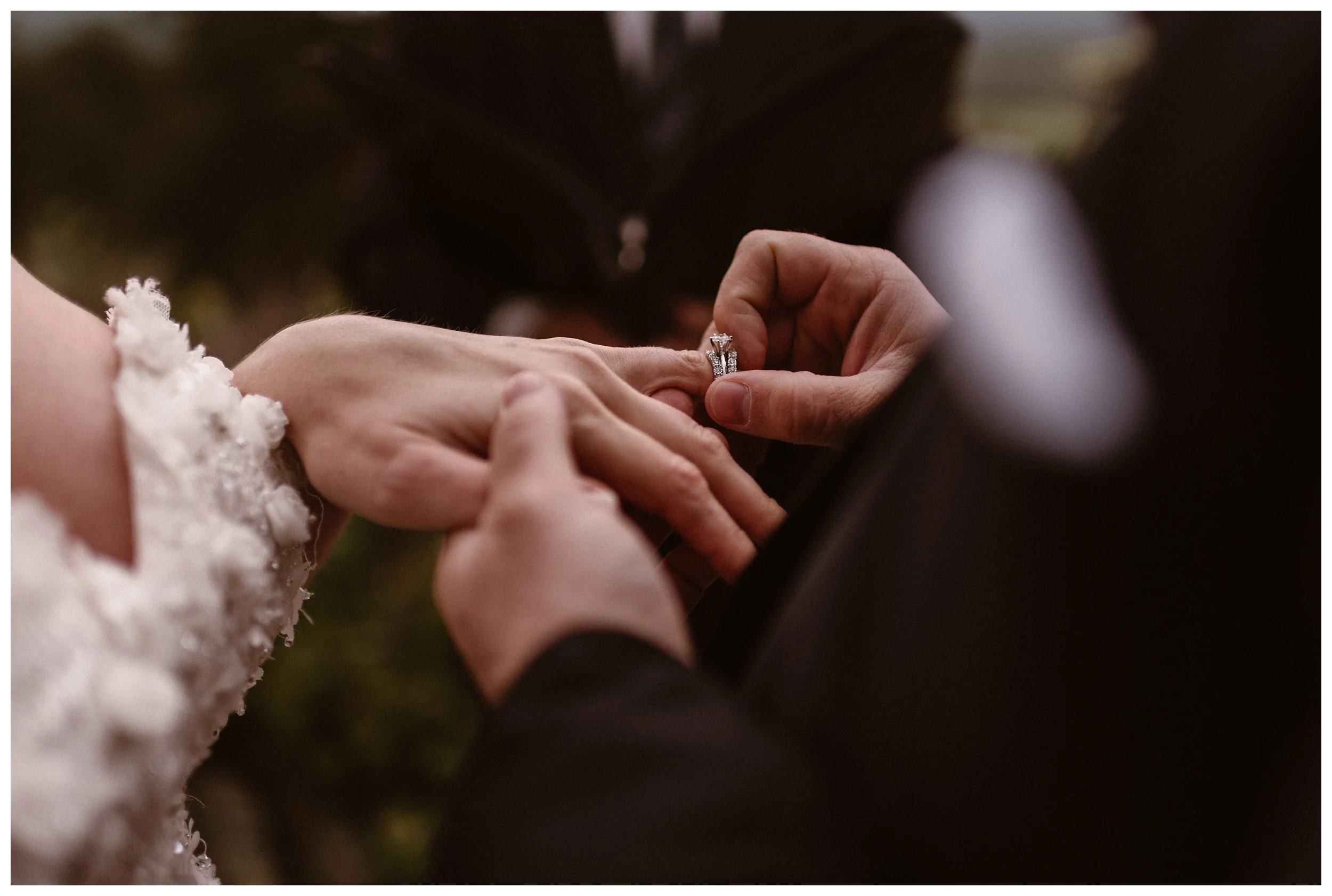 Zach places the wedding band on Alicia’s finger during their intimate elopement ceremony at Rocky Mountain National Park. Photo by Adventure Instead, Maddie Mae.