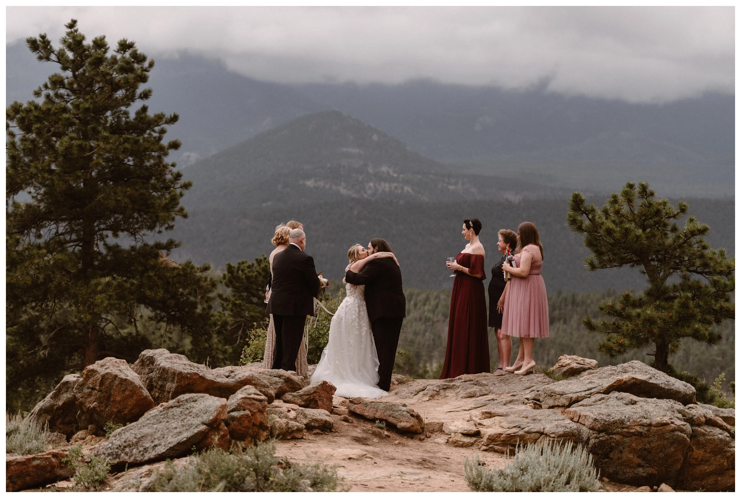 Alicia and Zach have their first kiss as husband and wife during their intimate elopement ceremony at Rocky Mountain National Park in Estes Park, Colorado. Photo by Adventure Instead, Maddie Mae.