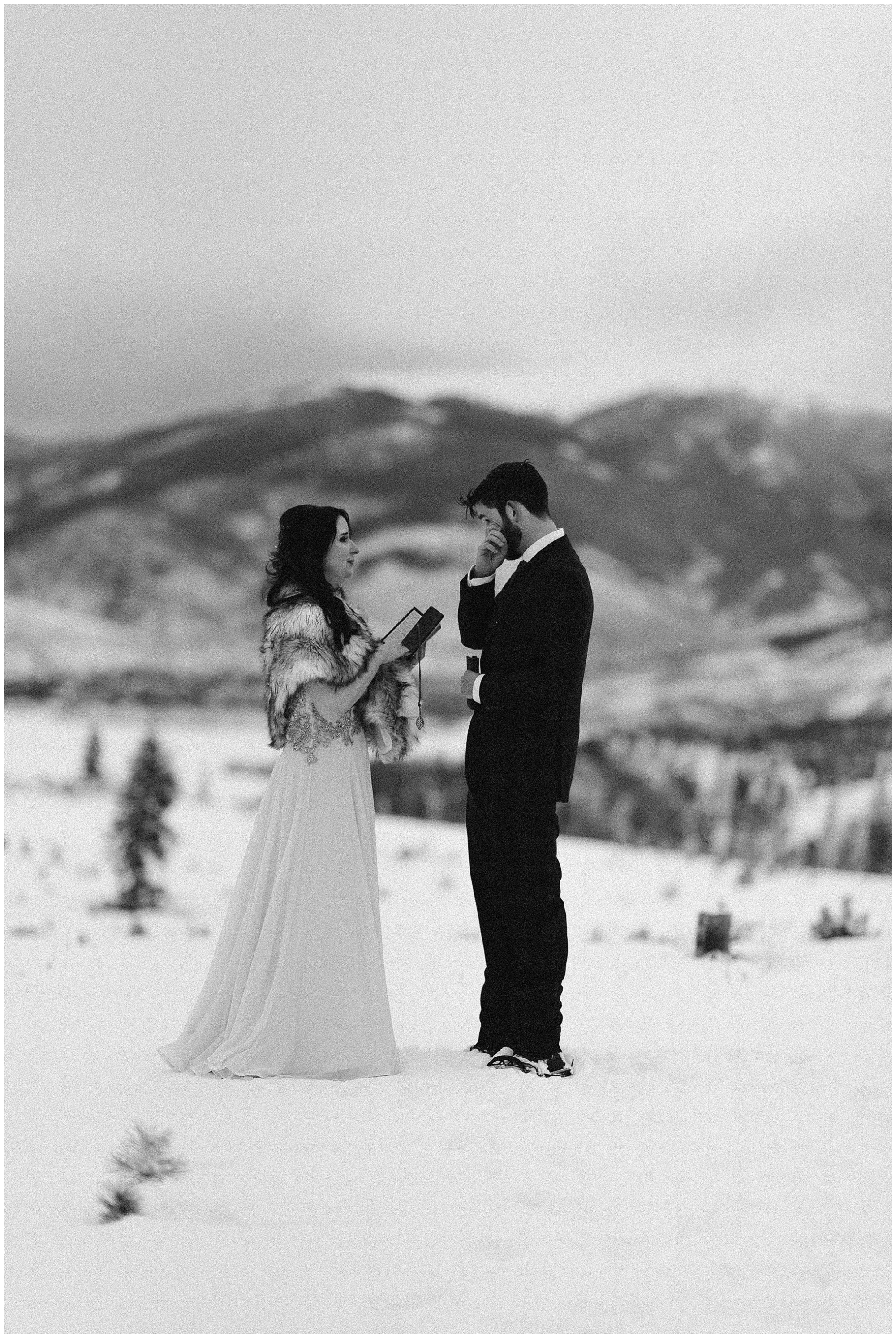 Marlayna and Austin had a winter elopement ceremony surrounded by the snowy Rocky Mountains at Sapphire Point in Dillon, Colorado. Photo by Adventure Instead, Maddie Mae Elopement Photographers.