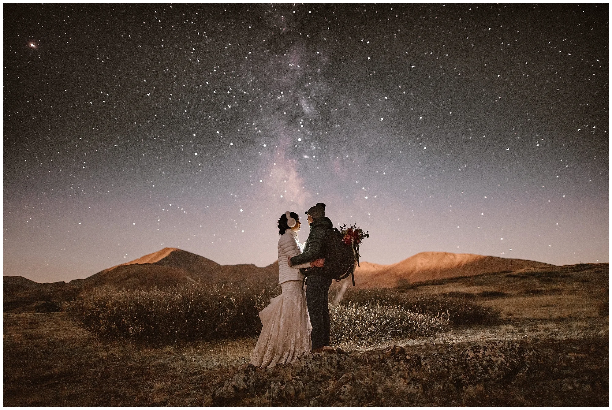 For winter elopements, make sure you dress in layers and take frequent breaks to stay warm. Stay out after the sun goes down at your hiking elopement and you’ll get stunning images of the Milky Way Galaxy. This image was also selected to Junebug Wedding’s top 50 Best Wedding Photos in the World! Where you elope and how you say your vows matters! Photo by Maddie Mae, Adventure Instead Elopement Photographers.
