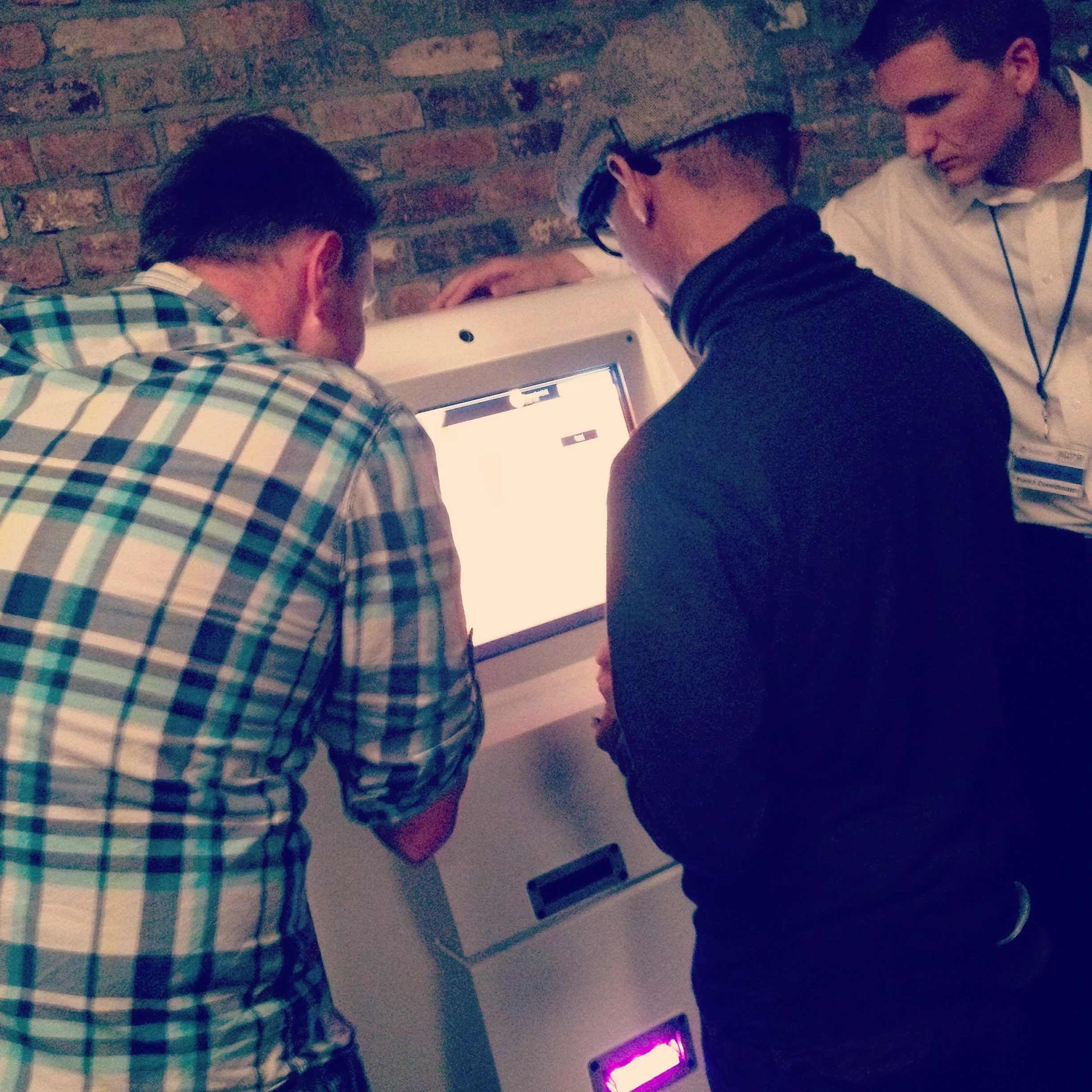 Exchanging cash for Bitcoins using my smart-phone at the unveiling of a Bitcoin ATM. 