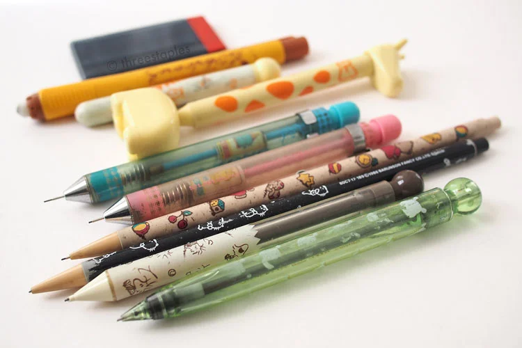 Mechanical pencils, assemble! I will never throw out that light green one; I love it to pieces. The pink and blue ones are fun: there’s a plastic piece inside that jumps whenever you push the lead out.