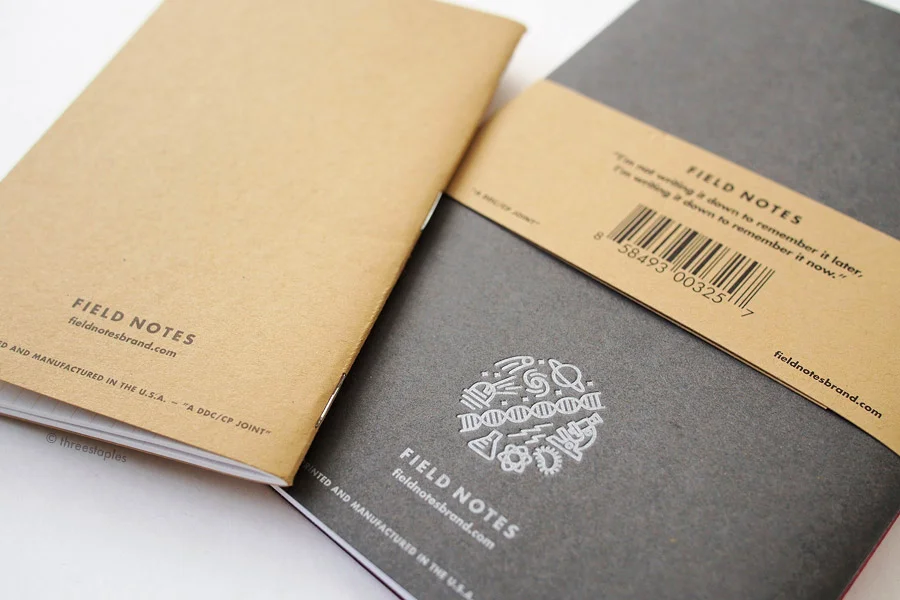 Original kraft memo book (left), next to the kraft belly band of Arts & Sciences.