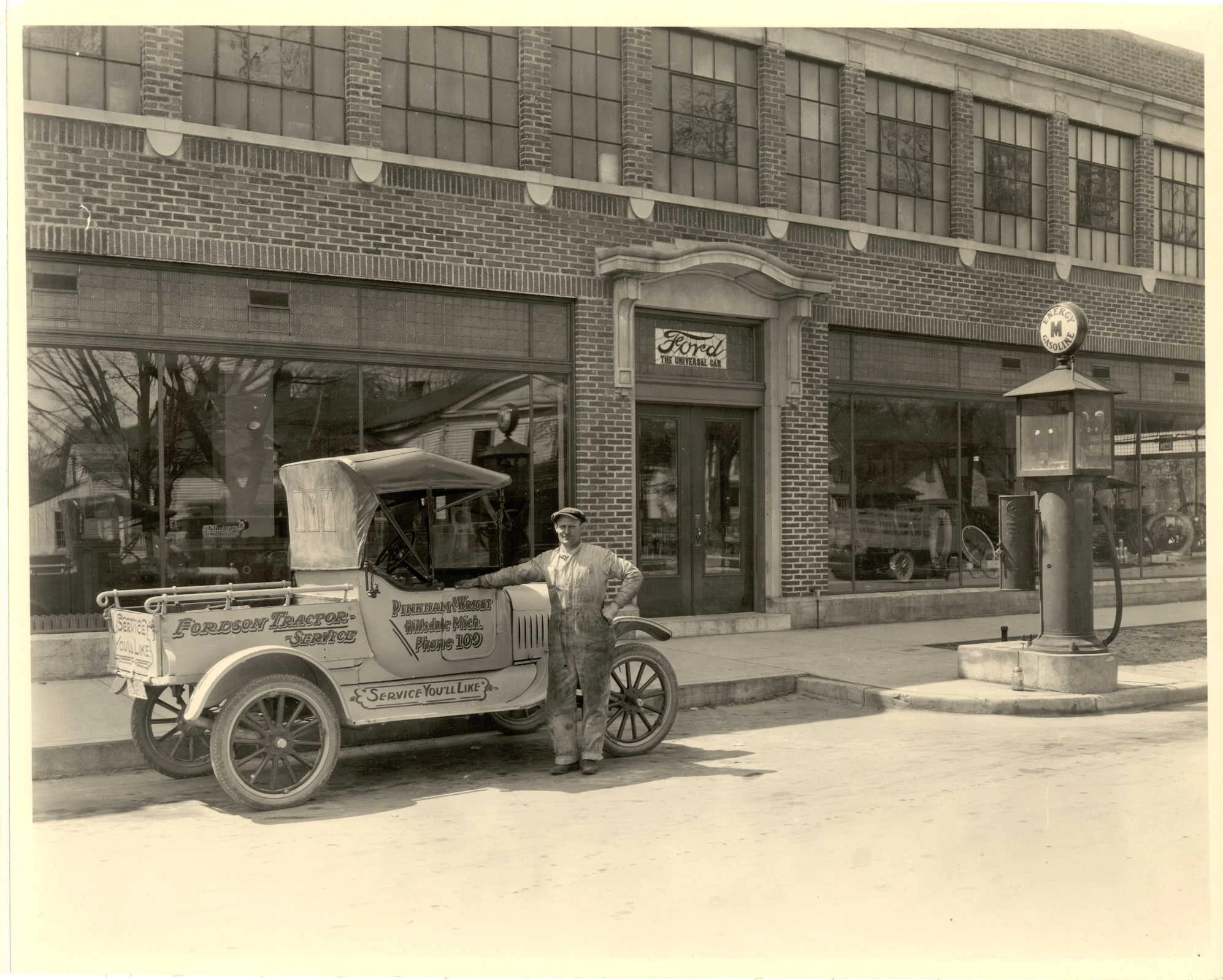 the Pinkham and wright ford dealership on Manning Street in Hillsdale had a gas pump in front.