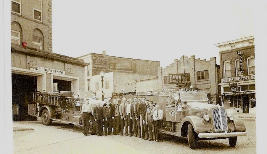 In this undated photo the Seagrave is shown closest to the fire station at city Hall. (photo donated by dan bisher)