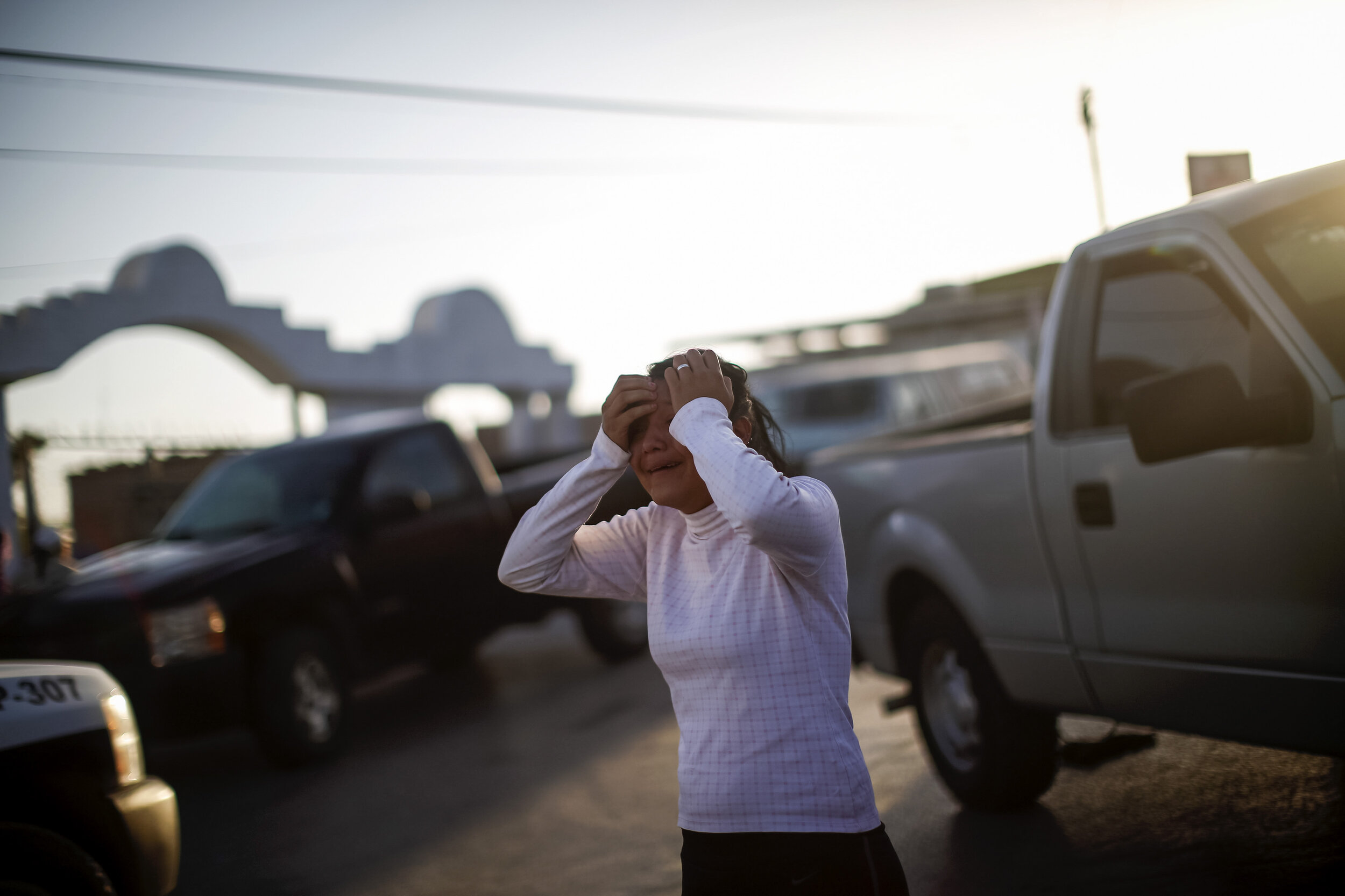   A woman reacts to a violent murder in Juarez, Mexico. 2013  