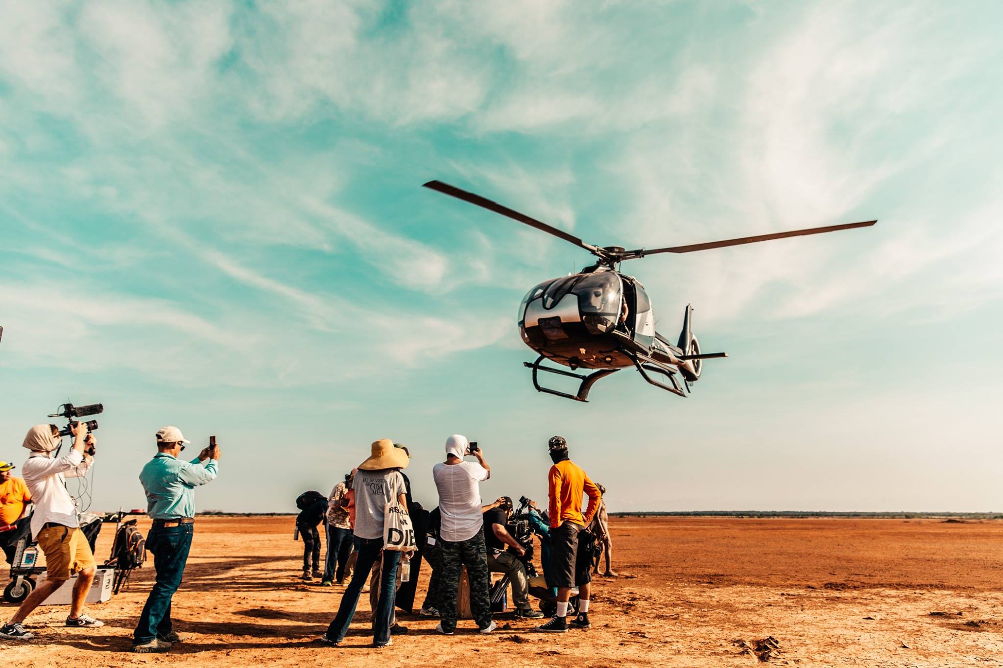 Filming in the desert, woefully unprepared for the dust kicked up by the choppers. Photo credit: Yasha Malekzad