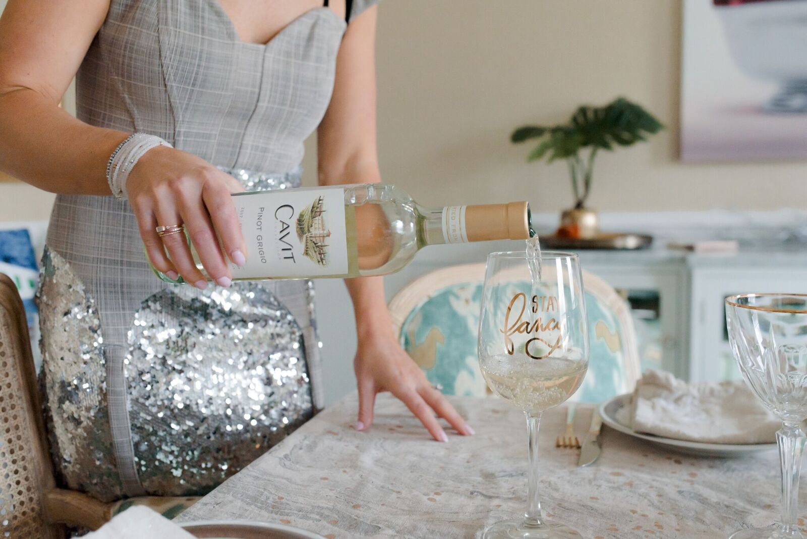 Johanna pouring a glass of Pinot Grigio 