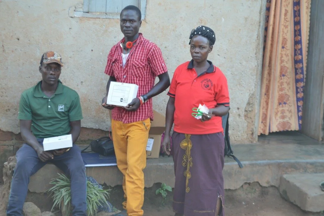 village mother giving out condoms.jpeg