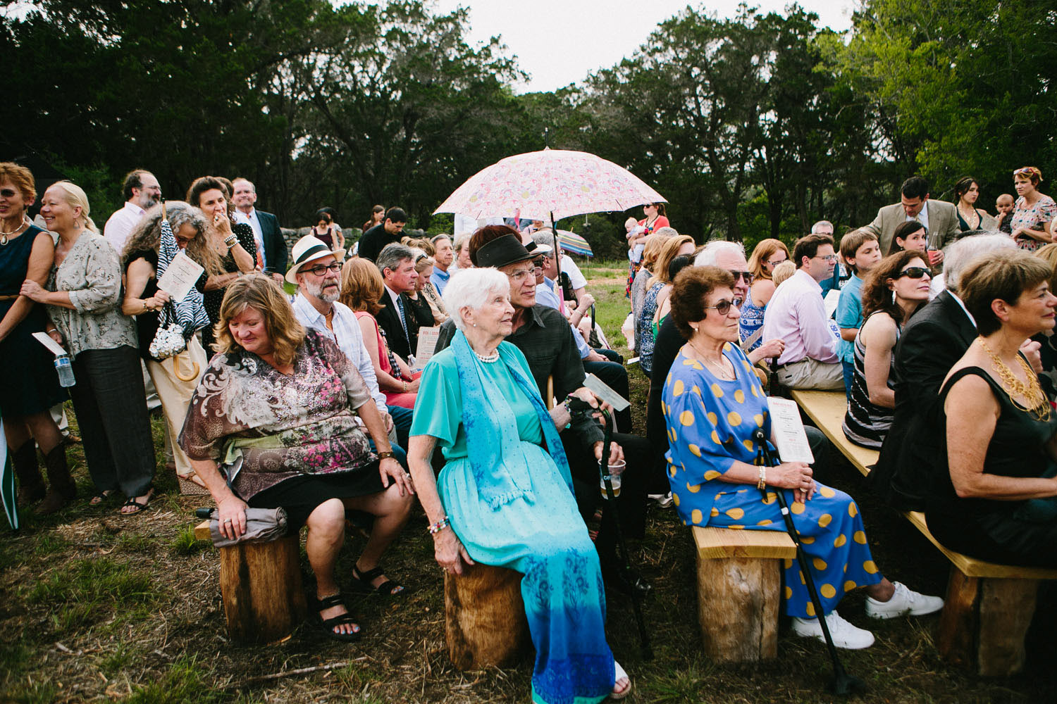 Wedding Guests on Homemade Pews | Home Ranch Wedding | Lisa Woods Photography