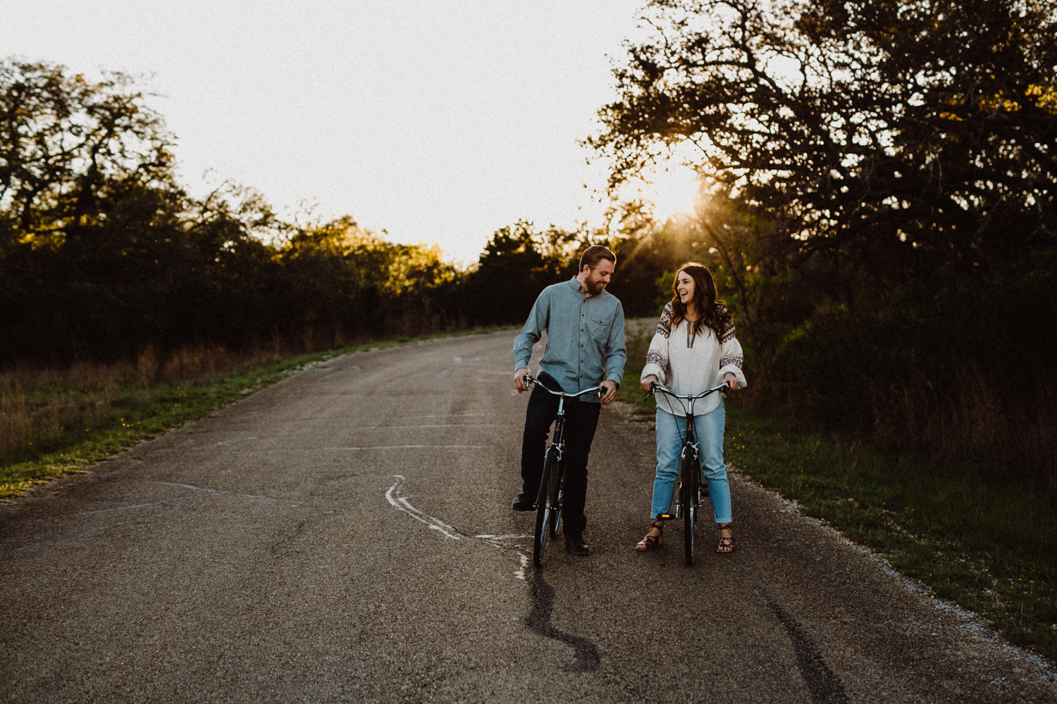 engaged couple on bikes