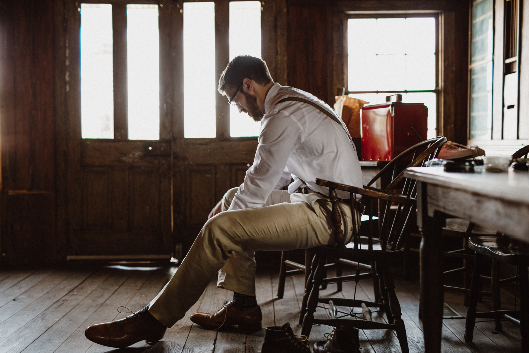 groom getting ready in saloon at star hill ranch