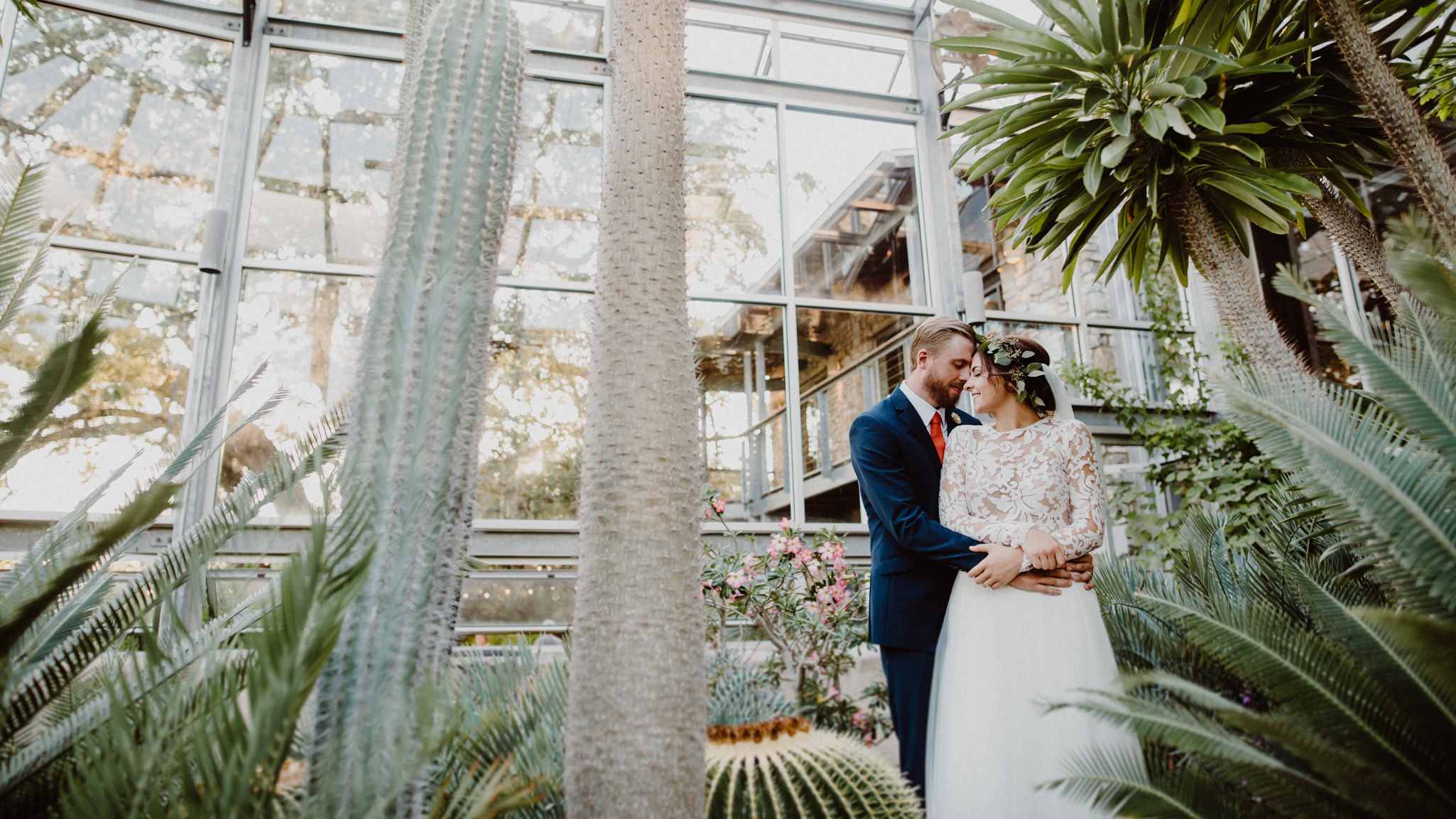 bride and groom in the greenhouse at driftwood