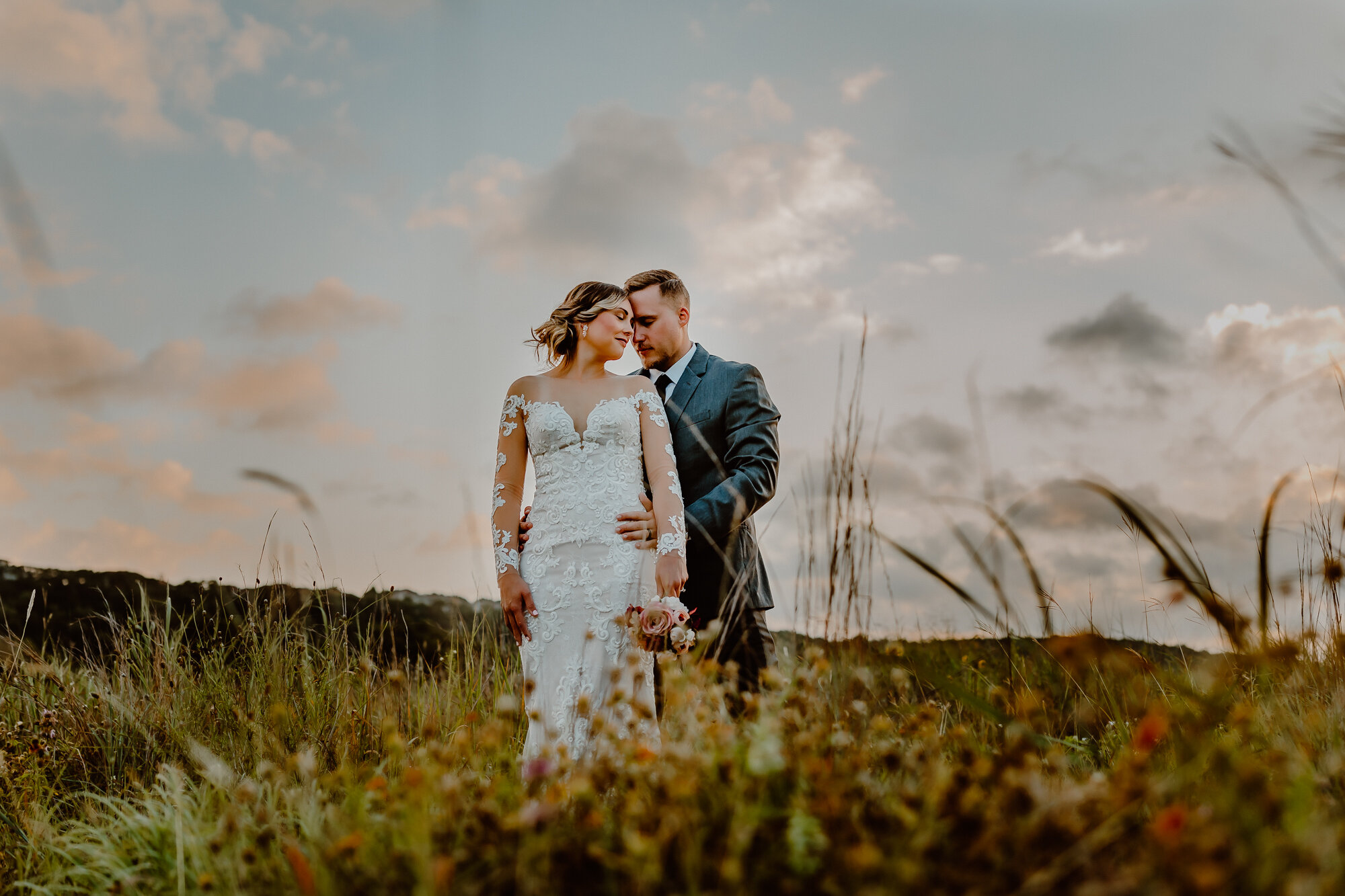 bride looking at groom in open field austin texas