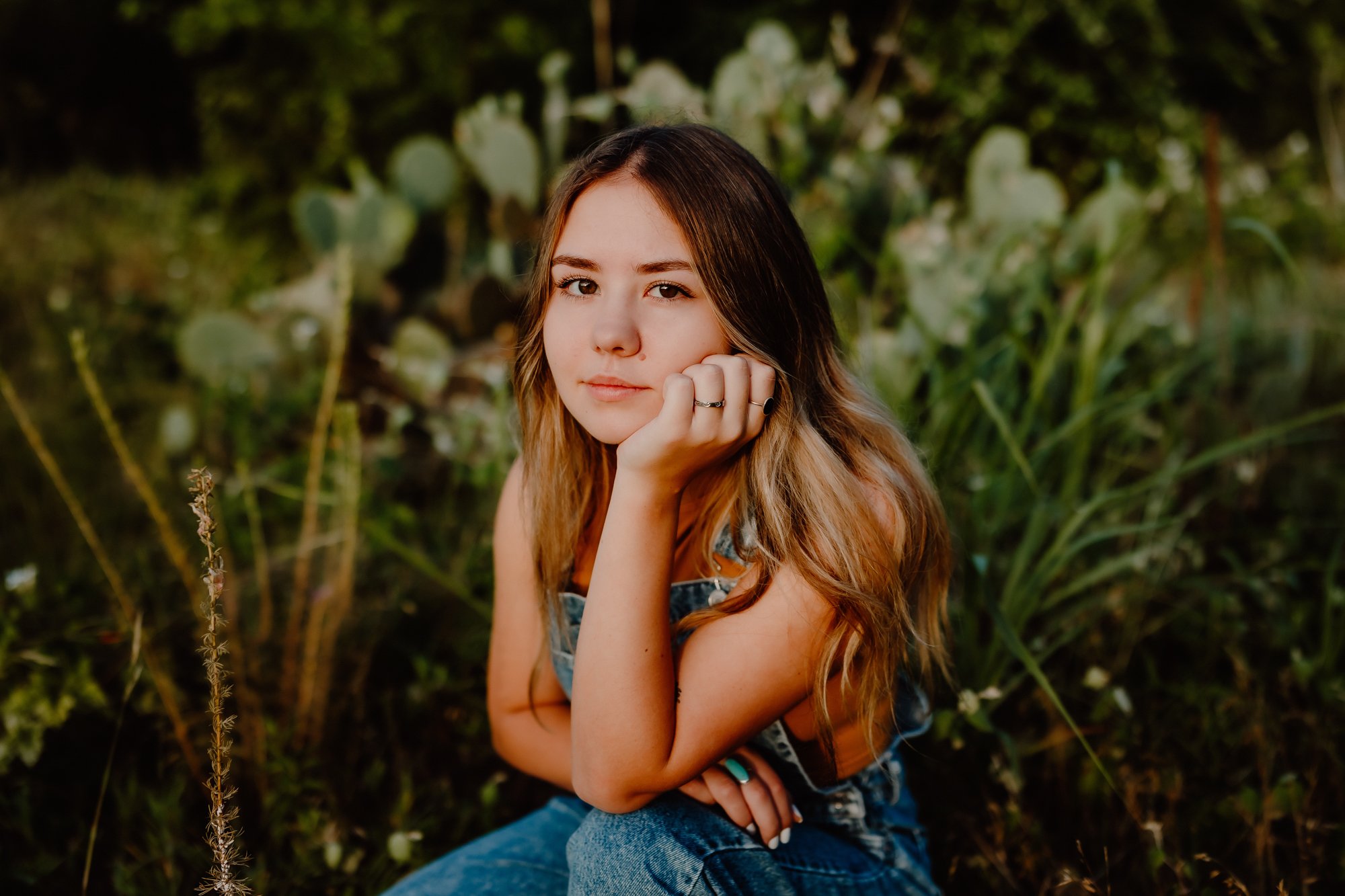 senior photo in field with cactus