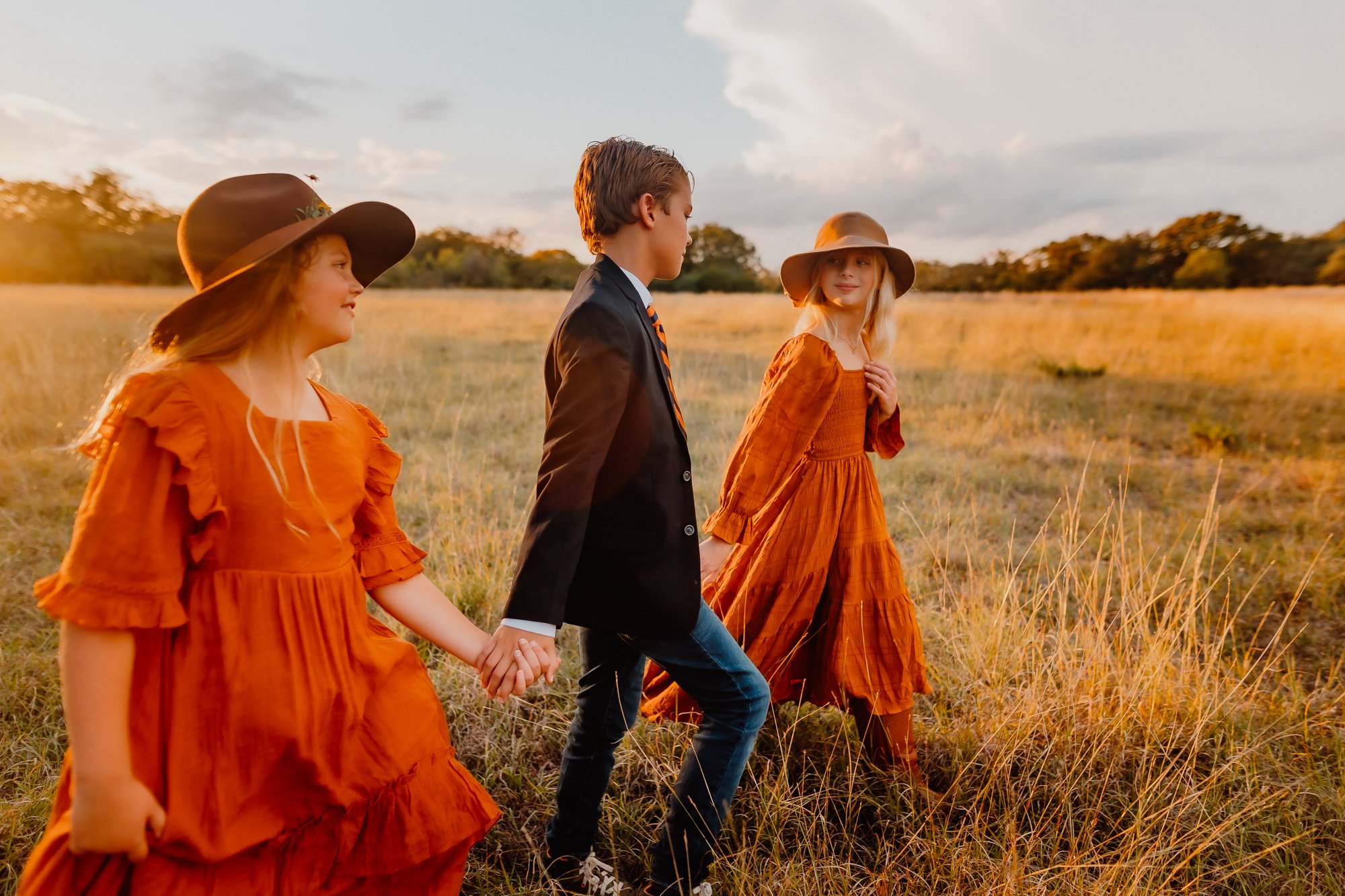 kids walking through Austin Texas field