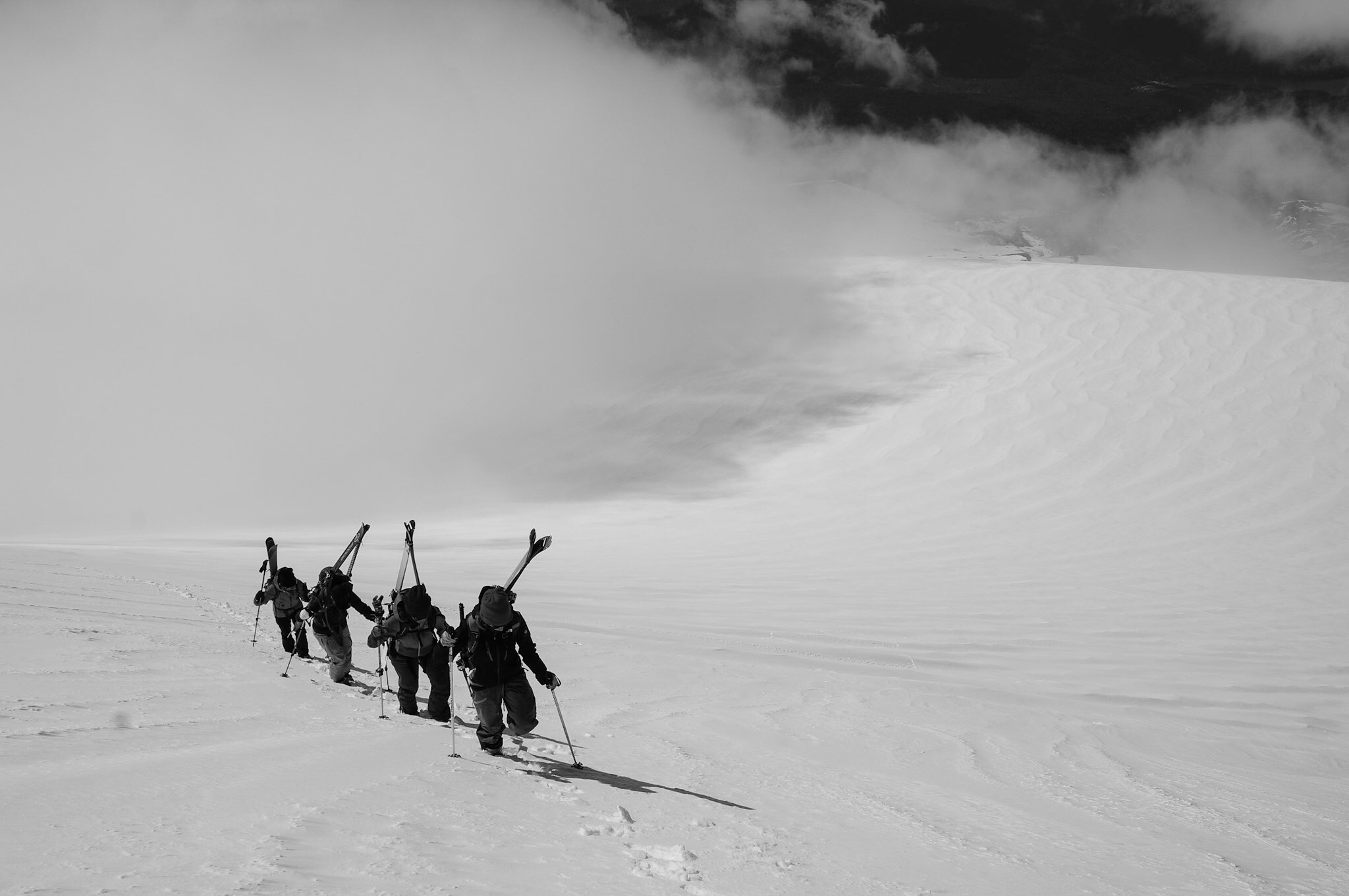 A group of friends climbing the final pitch of the first volcano they ever summited.