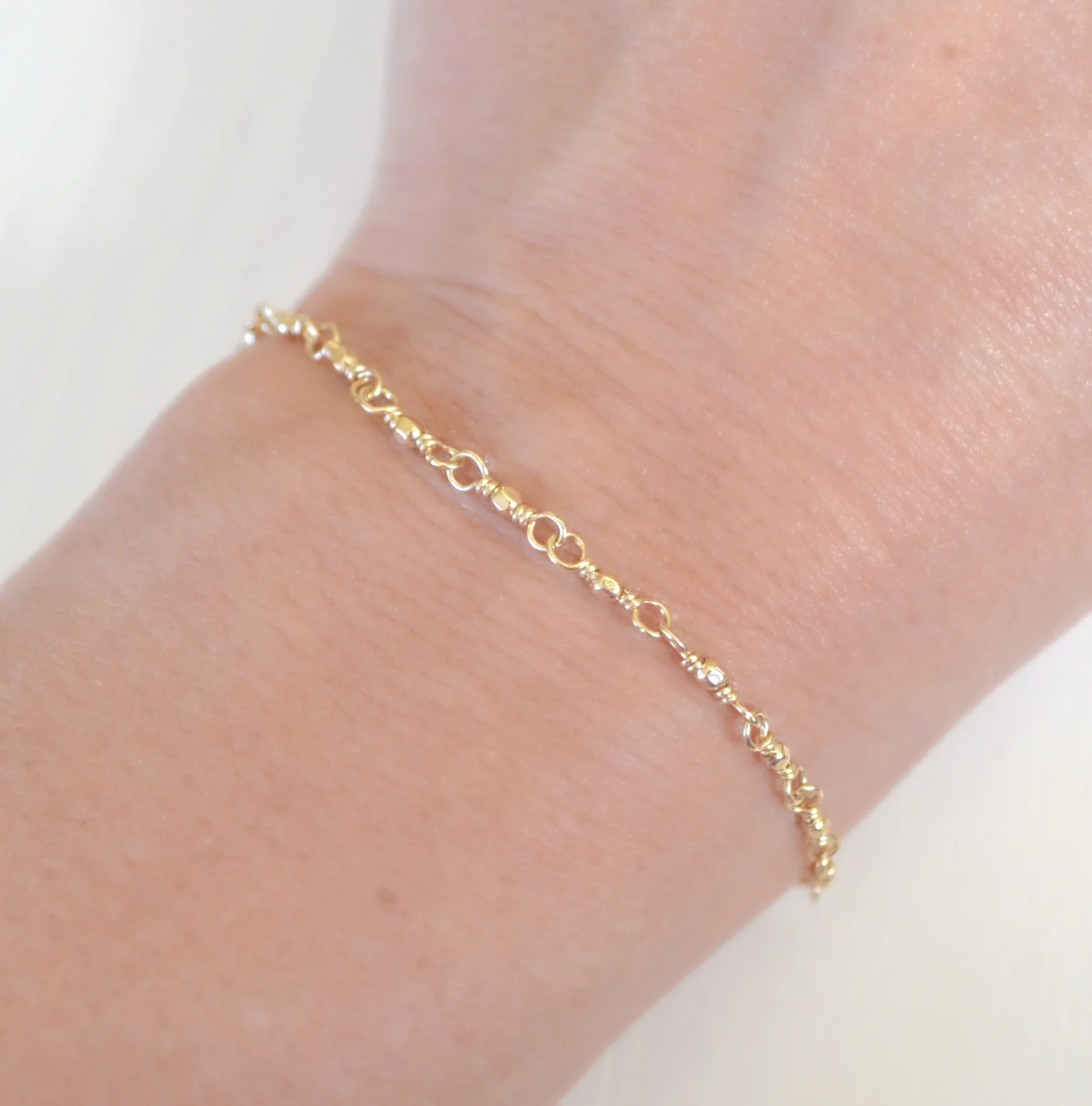 tiny gold filled beaded bracelet.JPG
