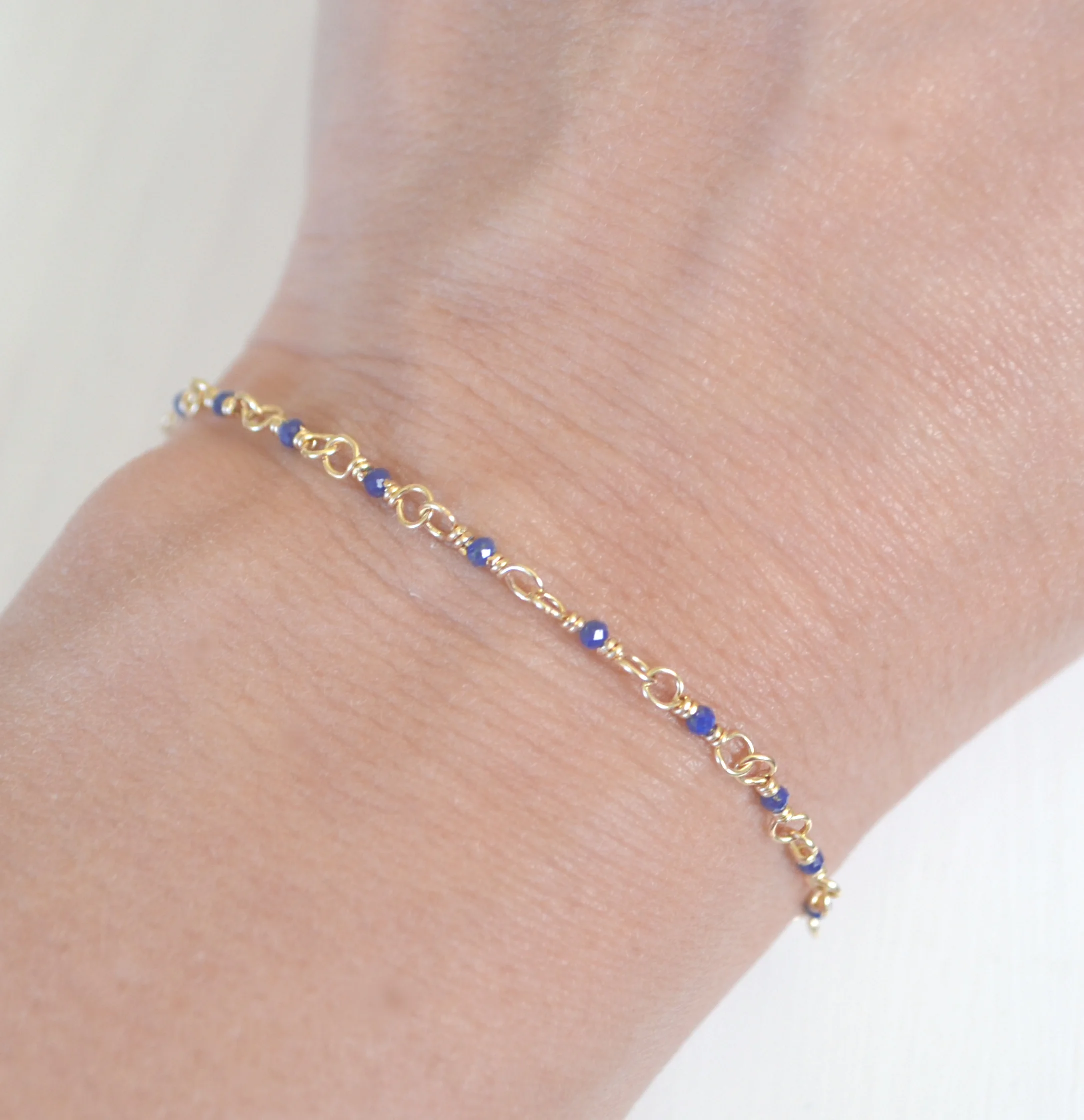 Tiny gold filled blue lapis lazuli beaded bracelet.JPG
