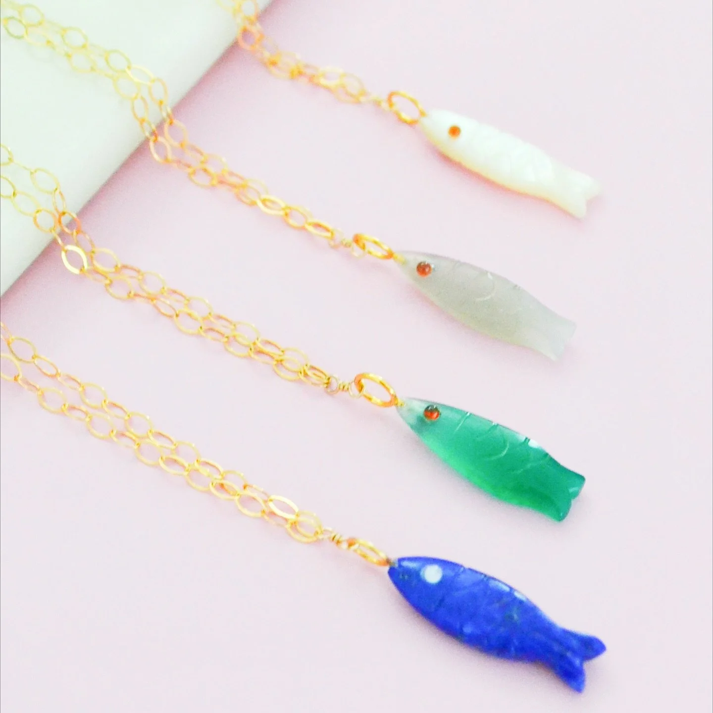 These fish gemstones were hand carved in India 💖 

Love these whimsical necklaces and can&rsquo;t wait to layer them with my favorite Fall sweaters!
.
.
.
.
.
.
#boycheriejewelry #goldfilledjewelry #jewelrybrand #jewelryofinstagram #wholesalejewelry