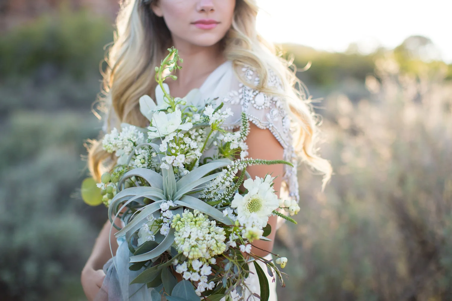organic bridal bouquet of tillandsia, allium, scabiosa and allium