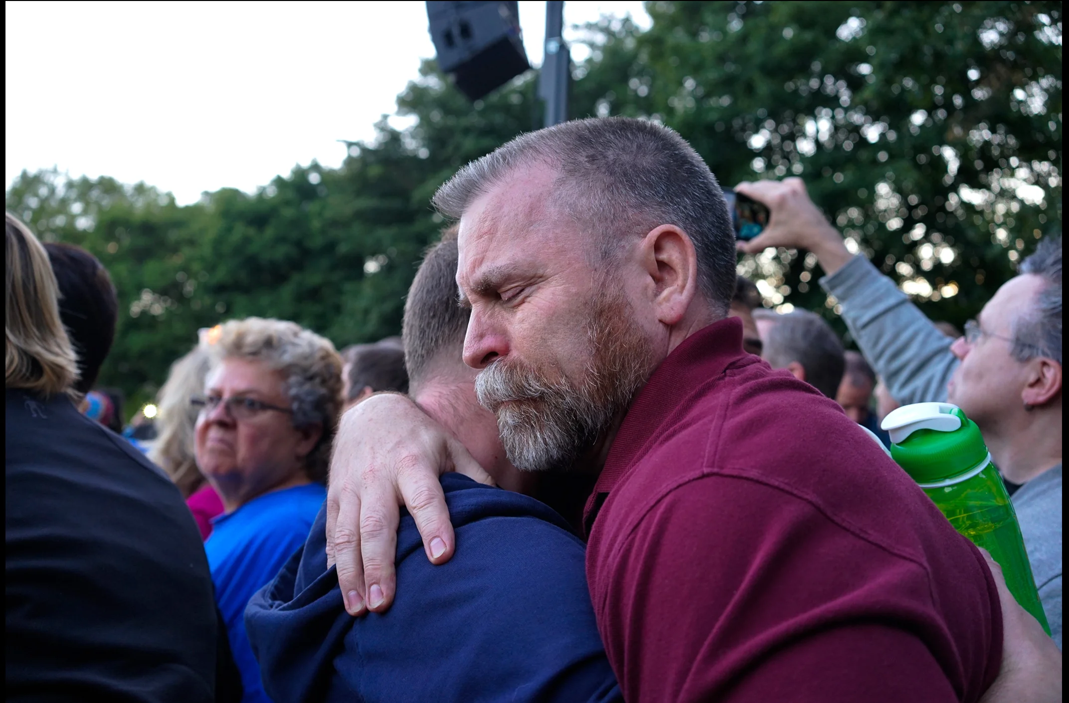 Community members morn the loss of lives in Orlando, Fl.