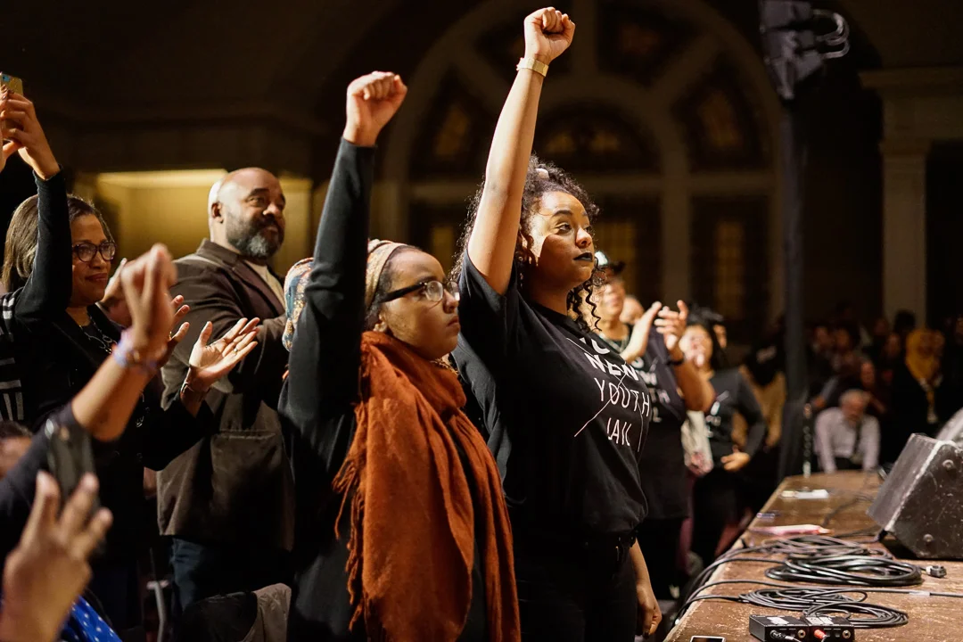No Youth Jail activists raise their fist in support of Angela Davis' opposition to mass incareration.