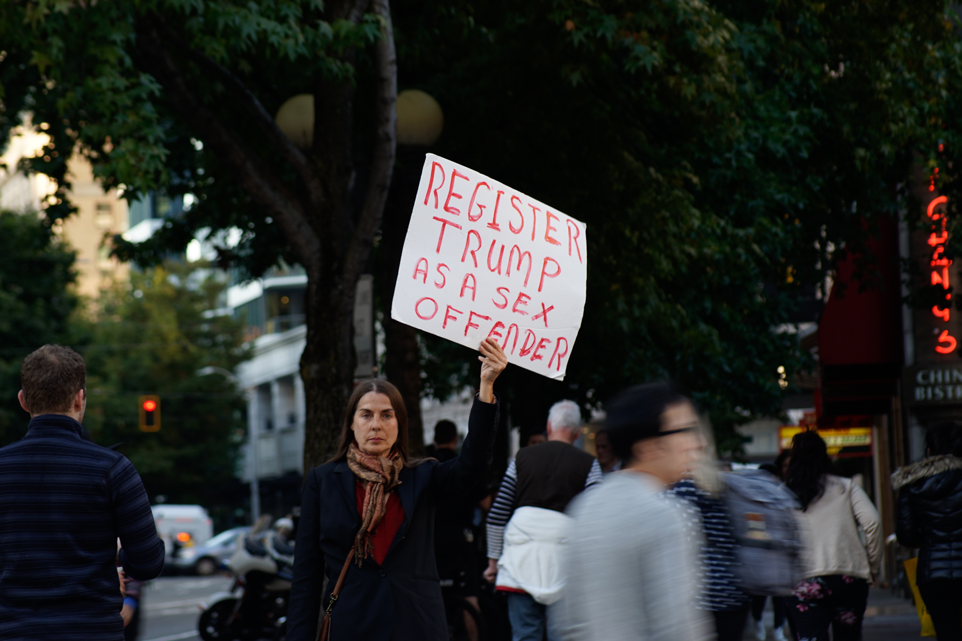  A woman holds a protest sign at the ‘Cancel Kavanaugh’ rally opposing the nomination of the new Supreme Court justice 